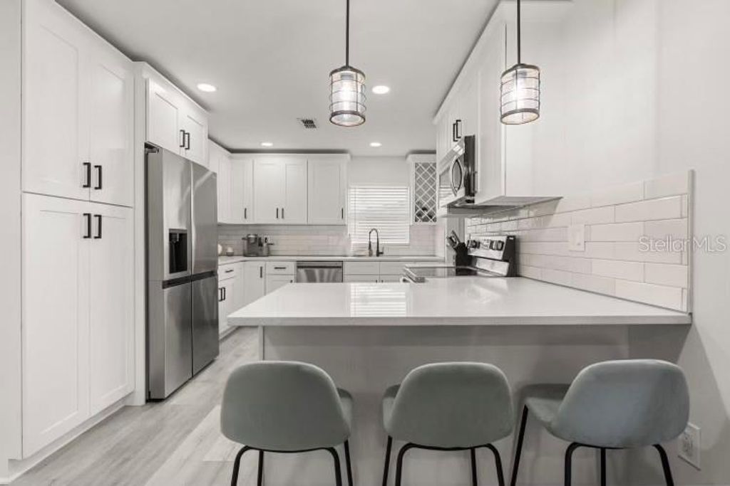 Photo of 13 Fanfair Ave, Orlando, FL 32811 (MLS # O6401420)