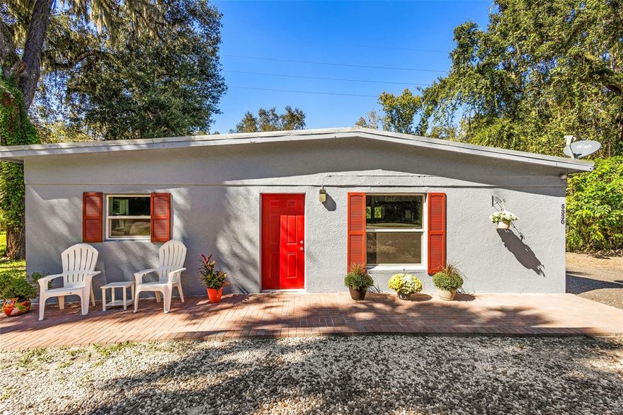 One or more photo(s) has been virtually staged. HUGE PRICE REDUCTION! SOLID BLOCK HOME WITH NEW CENTRAL HEAT AND AIR CONDITIONING (2025), NEW WINDOWS (2025), NEW METAL ROOF (2021)! Over 1,100 sq ft of heated/cooled living space, with ceramic tile floors throughout. NEW PAVER PATIO in front of home, private back yard with storage shed. Great starter or retirement home or investment opportunity.  Vacant lot next door is not included here but is also for sale. About 1 mile to DeLeon Springs State Park with fabulous swimming, walking trails, boat tours, and the popular Old Sugar Mill Pancake House. About 1 mile to Chuck Lennon County Park with public fields for soccer and baseball, racquetball courts, and mountain bike trails that are considered among the best in Florida.  About 1 mile to Woodruff National Wildlife Refuge with 22,000 acres of walking trails, marshes, hammocks and uplands -- a paradise for nature lovers and bird watchers. All this within easy distance of downtown DeLand, called the "Athens of Florida," with Stetson University, art galleries, fine-dining restaurants, art museum, grocery and retail stores, and the popular weekly Farmer's Market offering a wide variety of local produce.  DeLand is also known for its many art and music festivals where traffic is rerouted around the entire downtown area for full and safe festival enjoyment. Call today to see this home!