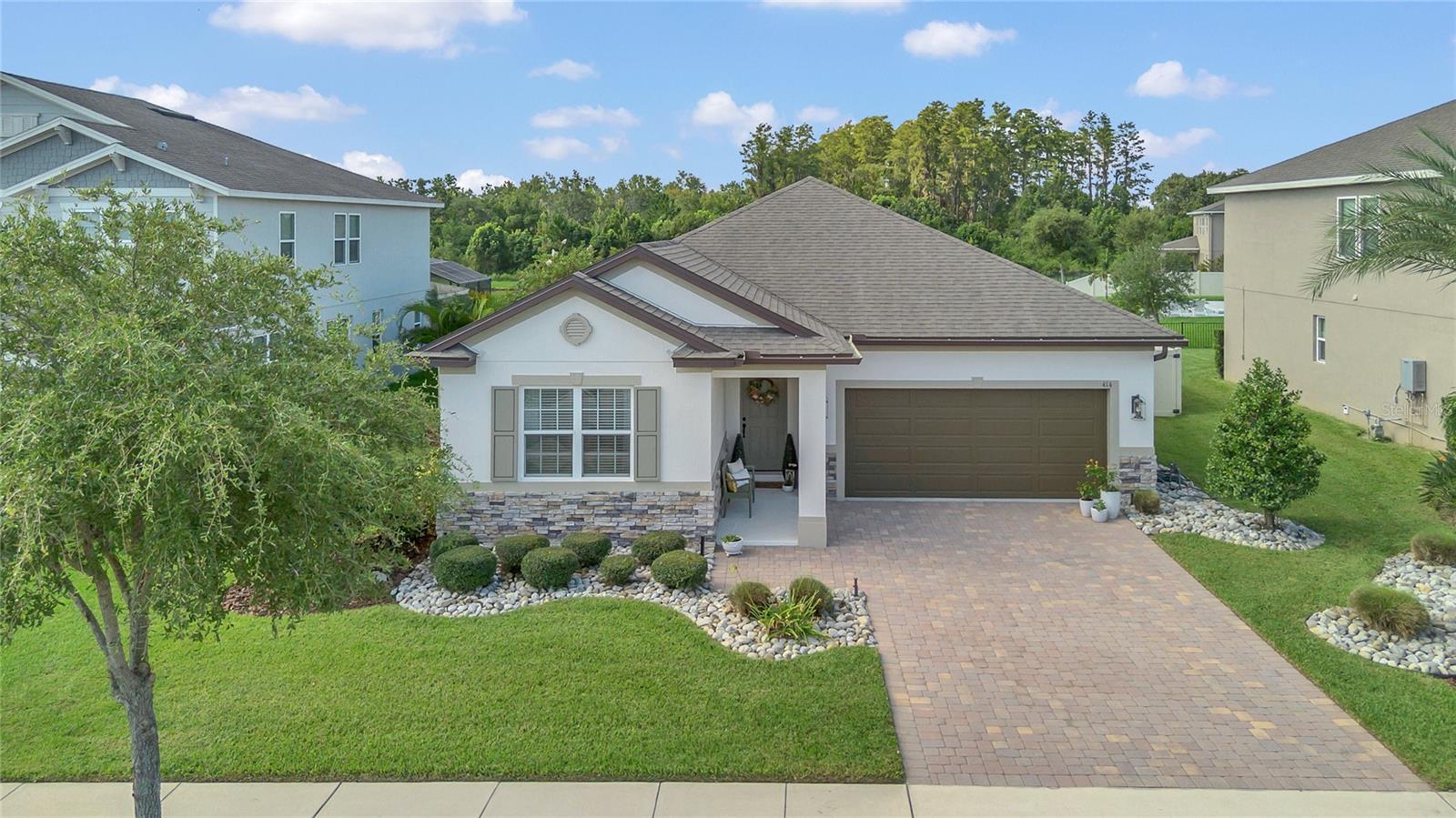 Welcoming One-Story Home with Pond Views in Gated Winter Garden Community...
Step inside this charming 3-bedroom, 2-bath home with a flexible bonus room and an open floorplan that’s perfect for everyday living. From the pavered drive to the beautifully landscaped front yard, this home greets you with curb appeal and comfort.
The spacious island kitchen is the heart of the home, with granite countertops and plenty of room to gather with family and friends. Just off the kitchen, the cozy family room features custom built-ins and a stone fireplace—an ideal spot to relax or entertain. Easy-care tile floors run throughout the home, adding both style and convenience.
The primary suite is your own private retreat, complete with peaceful pond views, a walk-in closet, and a spa-like bath with a jetted tub. Outside, enjoy Florida living at its finest on the screened patio, complete with a summer kitchen and stone fireplace, overlooking the fenced yard and tranquil pond.
You’ll also love the community amenities, including outdoor fitness, playground, and picnic area. With a 2-car garage and a great location in Winter Garden, this home offers comfort, charm, and convenience all in one.