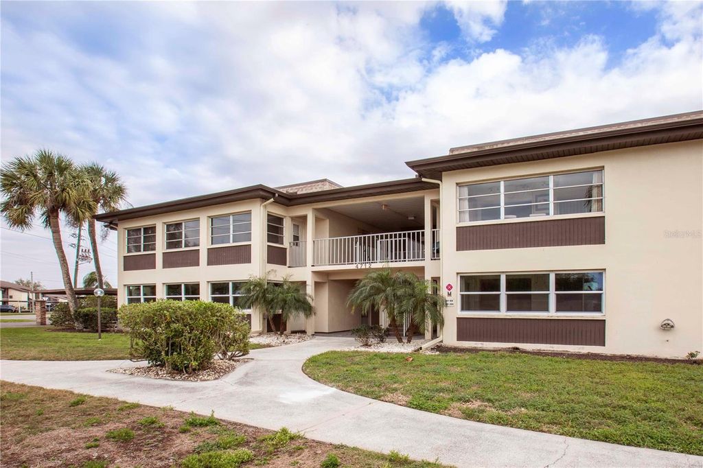 Photo of 4712 Marine Parkway #104, New Port Richey, FL 34652 (MLS # W7873195)