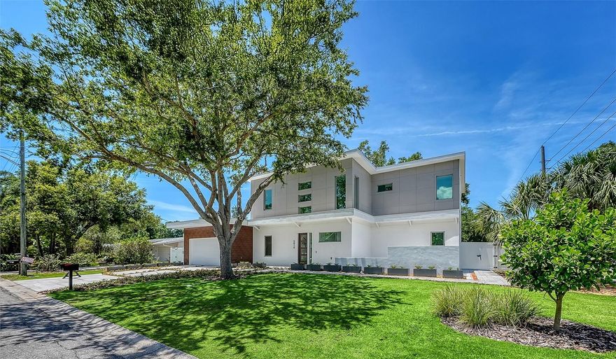 A statement of modern luxury and elevated Florida living, this newly constructed residence blends sophisticated design, expansive indoor-outdoor spaces, and an exceptional location, Situated on a prominent corner lot in Arlington Park, this stunning two-level home was thoughtfully designed to deliver comfort, functionality, and a true resort-style lifestyle experience. Featuring 5 bedrooms, 5 full bathrooms, and 1 half bath, this residence offers approximately 3,515 square feet of interior living space and over 5,834 total square feet including expansive outdoor living areas, balcony spaces, pool area, and garage. The first level features approximately 1,825 square feet thoughtfully distributed across the luxurious primary suite, an additional guest bedroom and full guest bath, spacious open-concept living areas, and a beautifully designed chef's kitchen with premium finishes, custom cabinetry, oversized island, and seamless connection to the outdoor entertaining spaces. An elevator provides convenient access between both levels, adding comfort and sophistication to the home. Step outside into your private backyard oasis featuring a resort-style pool, lush landscaping, and multiple outdoor areas designed to embrace the Florida lifestyle. One side of the property showcases a beautiful oak tree and garden setting, creating a peaceful natural atmosphere ideal for relaxing with family, friends, and pets. The second level offers approximately 1,690 square feet and includes an additional primary suite, two spacious guest bedrooms, and access to an incredible balcony designed to enjoy Sarasota's year-round sunshine and indoor-outdoor living experience. Situated on an oversized 10,200 square foot corner lot, this property offers the perfect balance between luxury, privacy, and outdoor enjoyment. Ideally located just steps from Arlington Park, minutes from Sarasota Memorial Hospital, Southside Village, Downtown Sarasota, and the world-renowned beaches of Siesta Key, this home combines luxury, location, and lifestyle in one of Sarasota's fastest-growing and most desirable neighborhoods. Schedule your private showing today and experience one of Arlington Park's most exciting new luxury offerings.
