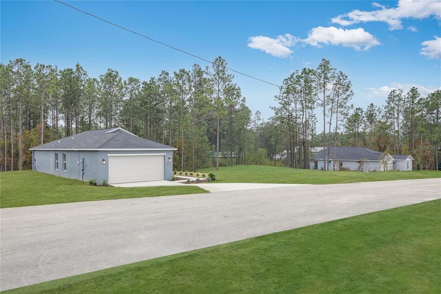 This single-story home shares an open layout between the kitchen, dining area and family room for easy entertaining, along with access to an outdoor space for year-round outdoor lounging. A luxe owner's suite is in the rear of the home and comes complete with an en-suite bathroom and walk-in closet. There are three secondary bedrooms at the front of the home, ideal for overnight guests or residents needing additional privacy, as well as a flex space that can transform to meet the household’s needs.
