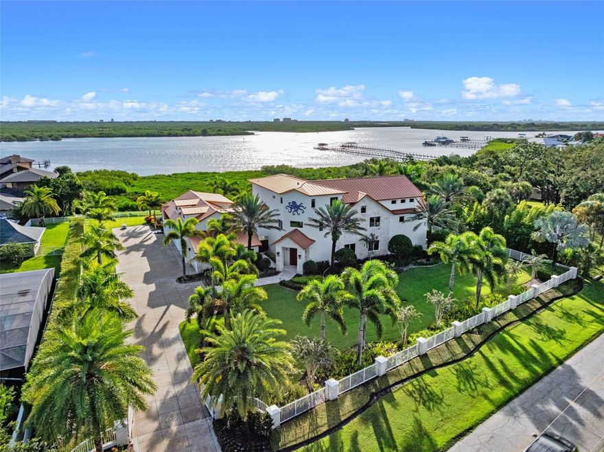 Welcome to 1511 S Riverside Dr – A Coastal Contemporary Masterpiece built on a rare 1.32 Acre Lot with over 210’ of direct Intracoastal Waterfrontage in the heart of New Smyrna Beach, FL. With over 8,270 Sqft Under Air and 12,000+ Total Sqft this property features State of the Art Mechanics, Breathtaking Design and Unique Amenities Including: Upscale Kitchen/Bar/Great Room with Wolf & Sub-Zero Appliances, 21’ Vaulted Ceilings and “Floating” Private Office  - Detached Guest House  - 6 Car Garage  - Expansive Primary Suite w/oversized balcony  - Resort Style Pool and Spa w/ 2,150 Sqft of Deck Space  - (2) Enormous Outdoor Dining & Living Spaces with Fully Equipped Summer Kitchens (Al Fresco Appliances) – 550 Bottle Wine Cellar – Luxury Theater Room w/ Dry Bar – 1,150 Sqft Bonus Room/Man-Cave - Hand-Selected Keystone Coral Inside/Out – Savant Home Automation System w/ Polk Speakers – Elevator  - Whole House Generac Generator – Cutting Edge Security System w/ SmokeCloak Device and Much, Much, More! Positioned on the prestigious Riverside Drive, this home offers an exclusive waterfront lifestyle just minutes from the Canal Street Historic District and Flagler Avenue—enjoy fine dining, boutique shopping, and vibrant entertainment, all just a quick golf cart ride away. Homes of this caliber—and on this scale—are exceedingly rare in New Smyrna Beach. Experience the ultimate in luxury coastal living. Call today to schedule your private tour!