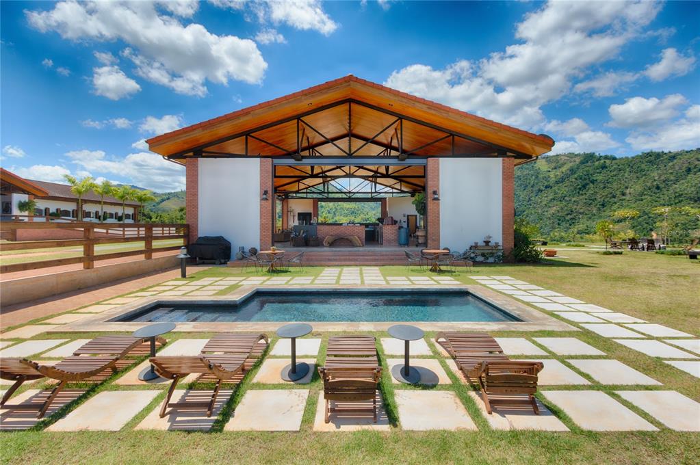 Hacienda La Nube, nestled amongst the island’s mountainous central region. The picturesque ranch offers stunning countryside views throughout the sprawling 53 plus acre property. This unique acreage consists of more than 12,000 square feet of construction spread across the property’s five luxury lodges, covered outdoor living space, state of the art stables for twenty horses and ring. The ranch’s five luxury lodges have floor to ceiling windows and balconies, allowing for breathtaking views of the surrounding pristine natural landscape. Each lodge consists of 483 square feet and an open layout with one bedroom, one bathroom and a kitchenette. Individual living space includes dining area, bar, large living room for intimate gatherings and pool. The property is ideal for a luxury boutique agro-tourism hospitality venture, a wellness retreat center or a sophisticated vacation rental.
Morovis is a picturesque and fertile municipality in central Puerto Rico. The lush land is naturally irrigated by waterways including the RÃo Grande de Manatà and its tributaries, making the municipality an agricultural hub for coffee, tobacco, and local fruits. It is also popular for cattle and dairy farming. The Cultural Center is a community hub dedicated to preserving the historical, cultural, and environmental heritage of the moroveños. The center offers everything from music and painting classes to poetry performances and art exhibitions.
Las Cabachuelas caverns, one of Puerto Rico’s most intriguing and alluring eco-tourism destinations. This natural attraction, which is part of Las Cabachuelas National Reserve, includes 60 entry points to a series of caves, caverns, and ditches. International and local restaurants are part of the gastronomical offering.