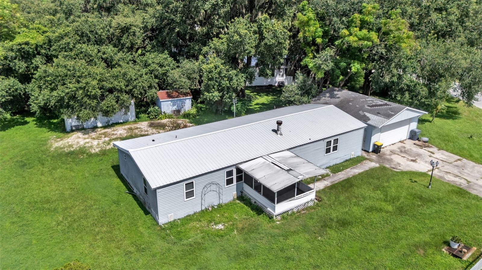 Great opportunity for an investor or handyman. This home offers 3 bedrooms, 2 bathrooms, a back deck for entertaining, a HUGE 28X24 detached garage/workshop, and a metal roof over the home. AC is newer (2023-2024), the drain field was replaced in 2024, new electrical panel 2024, and bathroom showers 2022.
