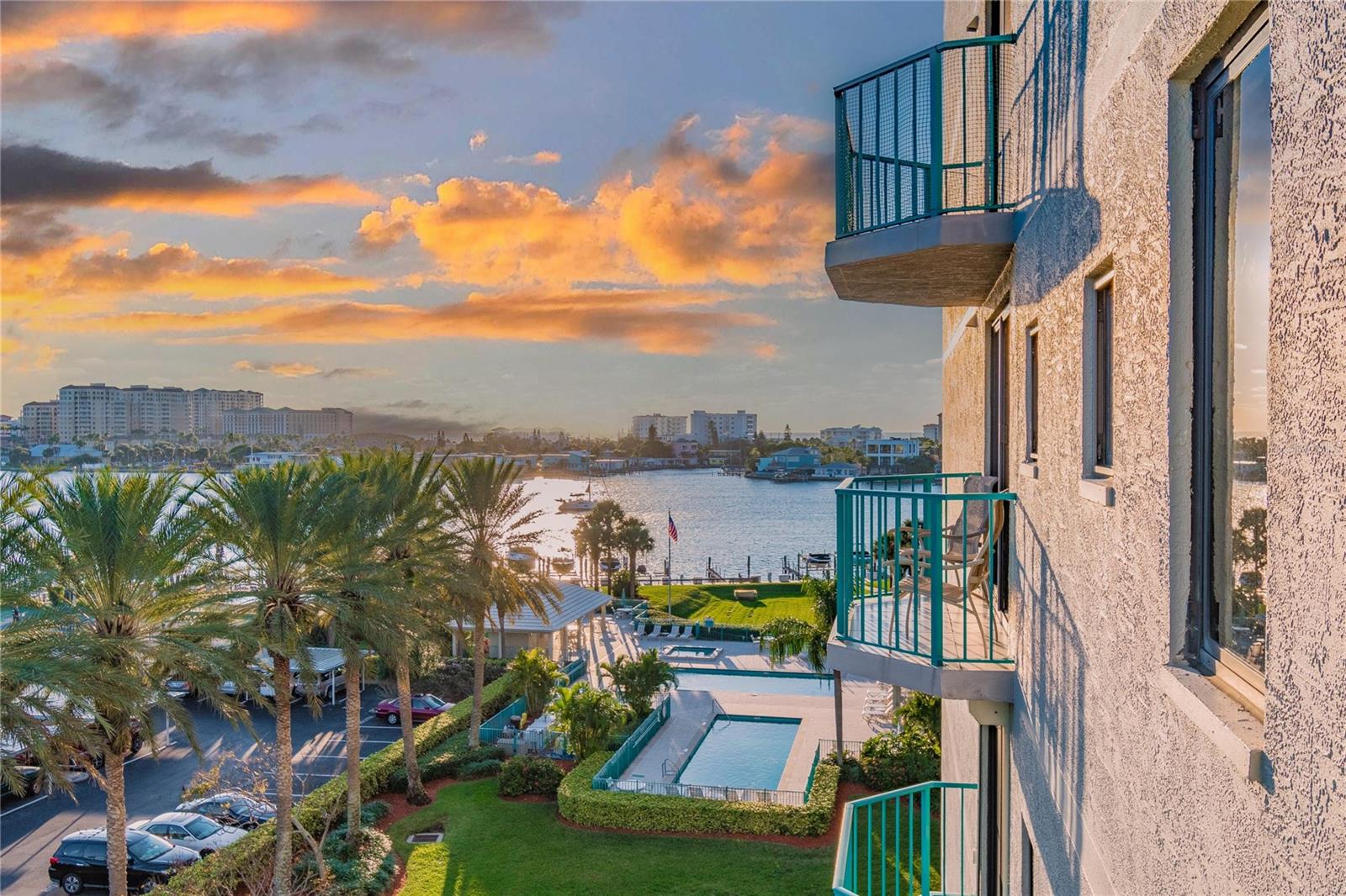 Stunning Southeast Corner Unit Condo with wrap-around BALCONY! Updated, Rare find, Kitchen Space Reimagined, Completely Open to Living and Dining. Welcome to Sunwatch Condominiums on Island Estates, 6th Floor, Water Views to the Southwest, see the Gulf and Intracoastal Water Views to the East, distant View of St. Joseph's Sound and Downtown Clearwater, the Sound Amphitheater, and to the Northeast see Dunedin too! This Condo is Move-In Ready with all large furniture staying for the new buyer! Peace of Mind and Energy Efficiency: 2022 REMOTE-controlled HURRICANE Shutters on all Sliders! And Nothing to do here! 2023 AC, 2021 Hot water tank, remodeled from one end of the condo to the other. Light and bright with an open floor plan and tile and wood floors, custom cabinets, stone tops, and high-end finishes. Specifically, to this unit UNDER BUILDING SECURE PARKING Space #45 under the building parking! Waterfront Resort Style Complex with 2 Tennis Courts, 2 Pools, Spa, Fitness Room, Billiards/Meeting Room, Party Room, 2 Covered Outdoor Pavilions, 2 Grills, Beautifully Landscaped Grounds, Guest Suites, and when available Marina Slips! Full-time property manager on site and building maintenance supervisor. Large Balcony invites you to enjoy the View of the Pools, the Passing Yachts, Personal Watercraft, Dolphins, Beach Activity, and Seasonal Sunsets. Just minutes from the Beach and just down the street from Dining, Bar and Grill, Grocery Store, UPS, Nail Salon, and Clearwater Marine Aquarium! This is a Pet-Friendly Building, Rentals allowed, One-year Minimum. This is a Great Condo Get Away, a way to End Your 1031 Exchange or a Full-Time Residence! What are you waiting for? Come Live the Lifestyle; Come Live on the Island!