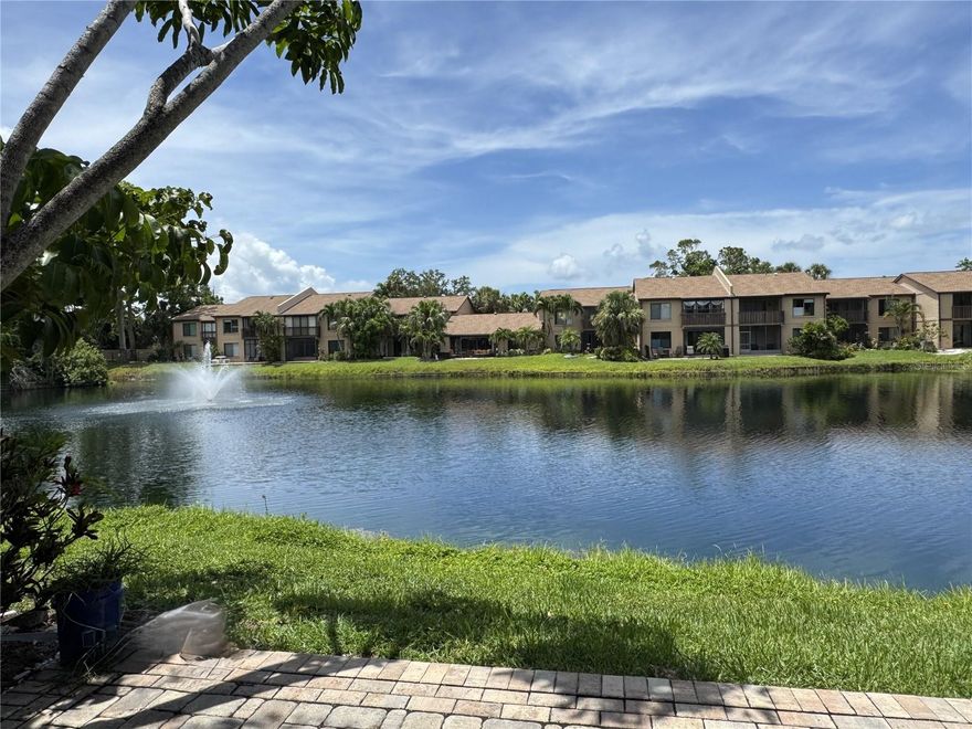 Discover this hidden gem in West Bradenton—welcome to The Lakes Condominiums. Just 10 minutes from the pristine shores of Anna Maria Island, this ground-level home offers over 1,400 sq ft of living space with tranquil pond-front views at an unbeatable price point.
Inside, enjoy a spacious kitchen with pretty wood cabinets a large kitchen island and long breakfast counter, open-concept living and dining areas adorned with crown molding, and two generously sized bedrooms, each with walk-in closets. The primary suite features an updated vanity and a modern shower equipped with grab bars and a pull-down seat for added comfort and the guest bath also enjoys a new vanity with a tub/shower combo. You’ll find plenty of storage throughout, including a linen closet and a versatile walk-in currently used as a mini workshop.
Start your mornings on the pavered patio, watching ducks glide across the pond, and spend your afternoons swimming in the community pool or playing pickleball and tennis at the on-site courts. The clubhouse is perfect for cards, gatherings, or catching the big game with friends.
As you enter the community, you’ll be greeted by lush Florida landscaping and winding roads that lead to your sun-drenched, south-facing home. Covered parking is conveniently located just steps from your front door.
The Lakes is just 2 minutes from Paradise Bay Plaza, offering easy access to groceries, dining, and shopping... and everything else Manatee County is famous for—world-class beaches, golf, arts, parks, the Riverwalk, top-tier medical facilities, sports and entertainment venues—are right at your fingertips. Even the Sarasota-Bradenton International Airport is just a short drive away. UTC and famous St. Armands Circle are just to the south about a half hour drive.  IMG Academy and many colleges and trade schools are all local higher education opportunities.
Skip the cold winters and high seasonal rental prices—make The Lakes your Florida escape. Pack your swimsuit and golf clubs… paradise awaits!