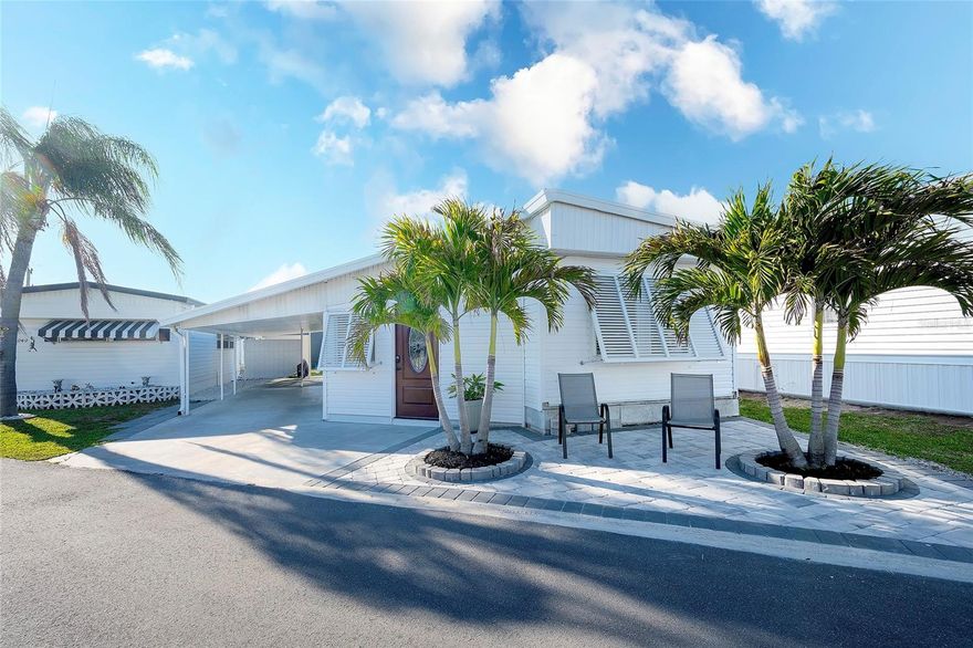 Mobile Estates is one of Sarasota’s hidden gems! RESIDENT OWNED community where your vote counts! OWN you own piece of Florida in this community. Where else can you enjoy the lifestyle, location and opportunities this home offers for such a price? A delightful blend of convenience and community living, making it an ideal spot for both seasonal visitors and year-round residents alike. Nestled in a prime location, less than 1 mile to Siesta Key. Mobile Estates provides easy access to the stunning beaches, area restaurants and walking distance to the charming Gulf Gate Village, known for its eclectic shops, restaurants, pubs and boutiques, all adding to the neighborhood's allure, offering residents a quaint and lively destination for shopping and entertainment. At Mobile Estates, residents experience the pinnacle of convenience with “share ownership” and currently the remarkably low HOA fee of only $215 per month, which covers essential amenities such as water and lawn maintenance. So, when you purchase this manufactured home here in Mobile Estates, you are an OWNER of the community property also. Furthermore, the community offers recreational facilities, including  pool (heated and chilled) with a heated spa, perfect for unwinding and socializing with neighbors. Bocce courts provide opportunities for friendly competition, while the recreation center serves as a hub for various activities and events, such as cards, games, food trucks, trivia nights, karaoke nights, and more, fostering a strong sense of camaraderie, fun and enjoyment among residents. This is a lifestyle you CAN AFFORD and enjoy. This 2 bedroom, 1.5 bath home is move in ready! Metal roof for longevity and low maintenance, freshly painted interior to match any décor. Newly painted exterior and newly installed paver front patio. Decorative laminate and tile flooring along with newly carpeted owner’s bedroom. Newer windows, new front door for great curb appeal. Step into a welcoming vestibule/foyer that even has room for a personal workstation/desk. The main living/dining/kitchen are open light and bright and enjoy the convenience of electric fireplace and ability to hang your favorite flat screen for all to enjoy. Kitchen boasts bright cabinetry, tiled back splash, under cabinet lighting, center island with additional storage along with NEWER  kitchen appliances. Decorative lighting and fans updating the look. New electrical updating 2023. Owners bath with decorative tile flooring and walk in shower for convenience. Guest enjoy privacy in BR2 with ensuite ½ bath. Enclosed additional storage area with inside laundry and work area. Step out to a private patio area under cover, perfect for that morning tea or afternoon happy hour. Enjoy the versatility of also the backyard sitting area along with front yard paver  landing area. You'll be able to get outside and relax while enjoying the Florida sunshine at all times of the day! Whether you live here 12 months of the year or 12 days, you are going to fall in love with Mobile Estates… call today, see today, buy today! Don't miss this opportunity.