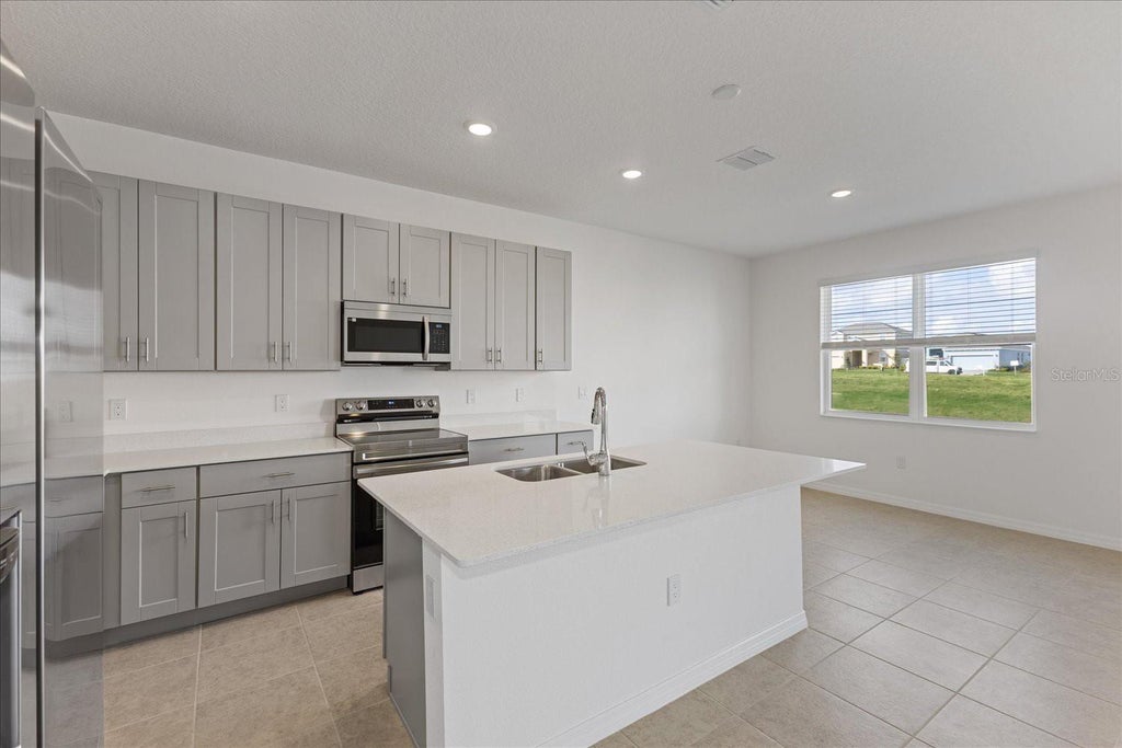 Photo of 218 Tarpon Bay Boulevard, Haines City, FL 33844 (MLS # O6413999)