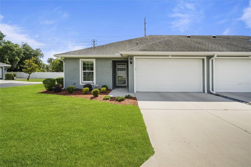 Experience carefree Florida living in this beautifully maintained LUXURY villa in the GATED Driftwood community, custom built in 2017 by Ryman Construction. This maintenance-free corner-unit villa offers the rare opportunity to OWN YOUR LAND while enjoying the ease and convenience of an amenity-rich community where the exterior upkeep is handled for you. The low HOA includes roof replacement every 15 years, exterior painting every 7 years, lawn care, water, sewer, trash, and exterior maintenance—allowing you to truly relax and enjoy the lifestyle! Residents also enjoy access to a community center/clubhouse, swimming pool, gazebo, and shuffleboard courts. Built to hurricane standards with concrete block and stucco construction, the cement blocks are foam-filled for added insulation and efficiency. Inside, you’ll find 1,443 square feet of thoughtfully designed living space with an enclosed lanai under roof, perfect for a flex space, office, den or sitting room. Elegant upgrades include Spanish lace ceilings and walls with rounded corners, archways leading to the Primary Suite and Den/Office, brushed nickel door levers, tile flooring throughout, solar tube natural lighting, lighted plant shelves, and custom honeycomb shades with designer window treatments. The spacious Primary Bath features dual sinks with granite countertops, raised commodes with added bidet, and a tiled tub/shower accented with glass listello bands. Modern convenience abounds with a fully integrated smart home system controlling the RING doorbell, lights, thermostat, front door lock, garage door opener, alarm system, and two security cameras through a custom app. Additional highlights include double-paned windows, storm door entry, owned Culligan water softener system with maintenance contract, and newer 2017 AC, roof, and water heater. The 2026 GE Profile washer and dryer with transferable 5-year warranty are included, and Furniture is negotiable, making this exceptional villa truly move-in ready. Located North of Tampa in Zephyrhills, within one mile of medical facilities, movie theater, shopping, bowling, YMCA and close to major highways for easy commute to Orlando, Ocala, international airports or the Beaches!  CALL TODAY!