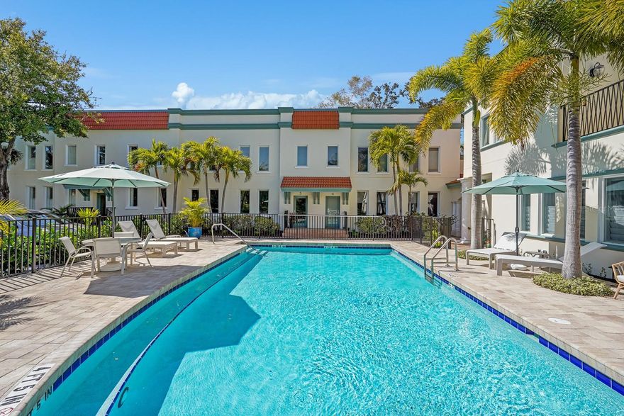One or more photo(s) has been virtually staged. Significant Price Adjustment - Thoughtfully repositioned to reflect today’s market, this residence now represents one of the most compelling offerings in its category.

Trade snow for sunshine and enjoy the comfort of Florida living! Tucked within the charm of Historic Laurel Park, this beautifully refined three-bedroom, three-bath townhome with a loft offers a rare blend of privacy, sophistication, and walkable downtown living in the heart of Sarasota.

Perfectly positioned within the well designed building, deliberately built to enhance privacy and showcase tranquil views of the community pool and lush greenery from every view—rather than looking directly into neighboring units.The two-story layout balances architectural elegance with effortless functionality, creating an inviting flow for both daily life and entertaining. Recent enhancements provide peace of mind and elevated style, including new luxury vinyl flooring, fresh interior and exterior paint, a new HVAC system, and a new roof. The kitchen is well-appointed for modern living with a gas range, complemented by the efficiency of a tankless water heater.

Sunlight pours through tall casement windows, filling the home with a bright, airy ambiance and highlighting its understated finishes. The first level includes a private bedroom with a full bath conveniently located across the hall—ideal for guests or a dedicated home office. Upstairs, the primary suite and an additional bedroom each enjoy their own ensuite baths, along with a versatile loft space perfectly suited for a den, office, fitness studio, or flex space to meet today’s lifestyle needs.

From the expansive living areas, tranquil views overlook the community pool, offering a serene backdrop that feels both relaxed and elevated. Set within a pet-friendly enclave, this residence also delivers exceptional walkability—placing Sarasota’s acclaimed dining, galleries, cultural venues, waterfront parks and marinas just steps from your door. 

Additional conveniences include shared outdoor space with community grill or room for your own, two dedicated parking spaces and access to a community storage room ideal for beach chairs, bicycles, pool accessories, and seasonal items, adding both practicality and ease to downtown living. HOA dues are comparatively lower than many nearby communities, enhancing the overall value of this downtown lifestyle.

Timeless, quiet, and impeccably maintained, this is downtown Sarasota living at its most refined—within one of the city’s most coveted neighborhoods.