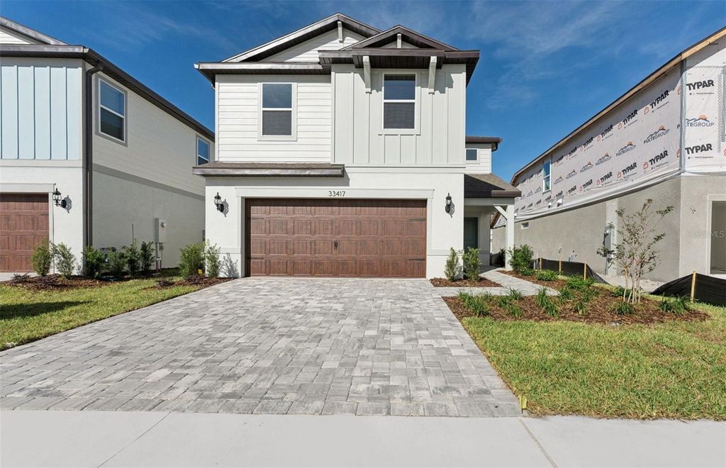 Photo of 33417 Binding Ties Lane, Wesley Chapel, FL 33545 (MLS # TB8403766)