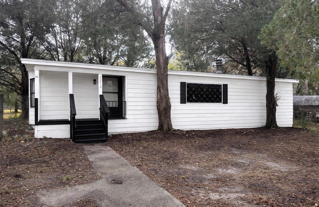 Photo of 17718 Rockledge Avenue, Spring Hill, FL 34610 (MLS # TB8518566)