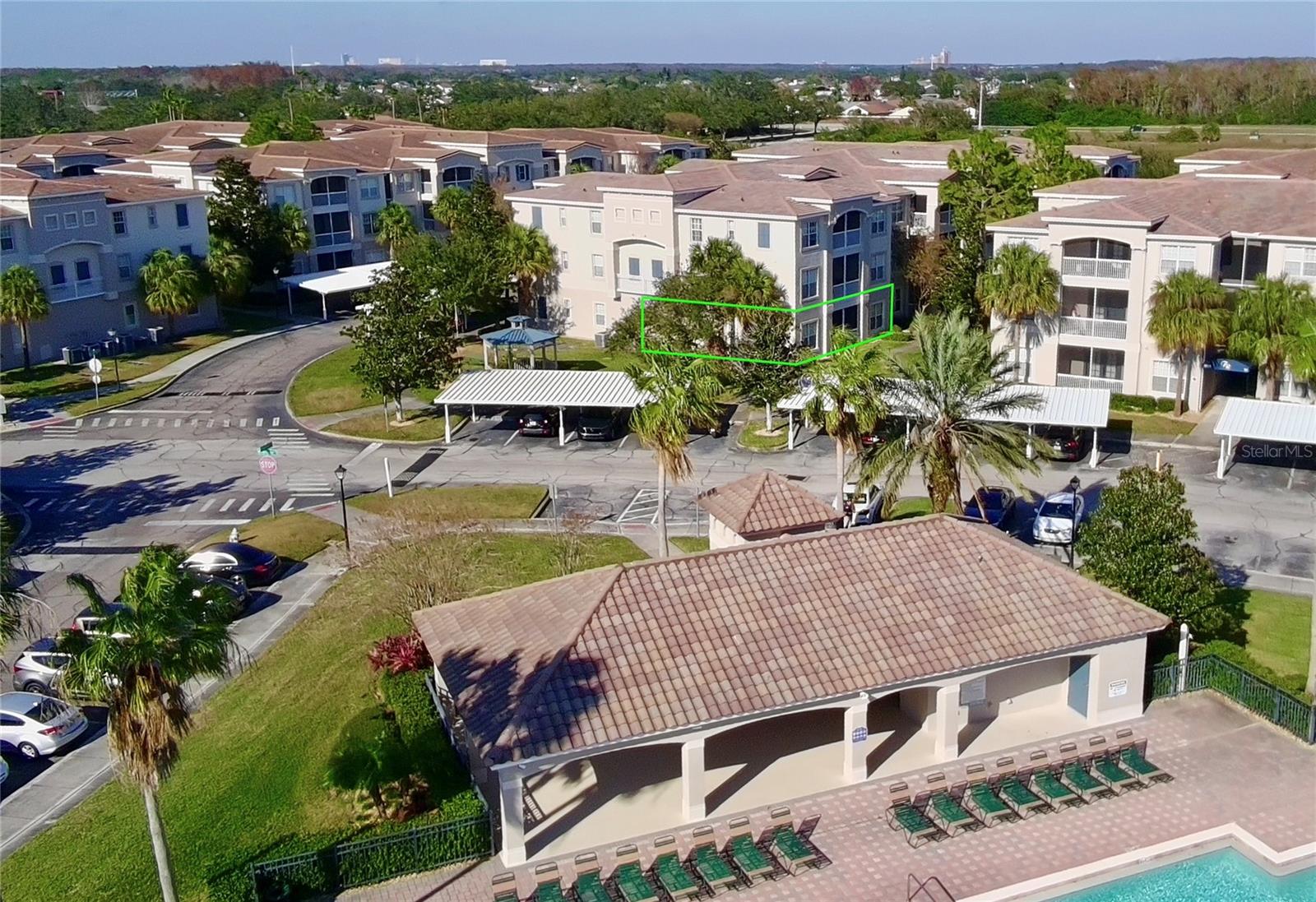 Here's your OPPORTUNITY to own a GORGEOUSLY upgraded, 1st-floor CORNER UNIT in the private, gated Community of Flora Ridge! Spacious layout with split floor plan. This STUNNING unit has a park-like setting with a gazebo just outside. It's adjacent to the pool and lake for fantastic views. The Community is so close to The Loop, shopping, theme parks, and airports, but so quiet it feels miles away! Interior upgrades include wood floors, granite countertops, stainless appliances, solid-wood cabinets, window treatments, etc. New tile roof and exterior paint will provide peace of mind for years to come. Make an appointment today to make this beautiful home yours!