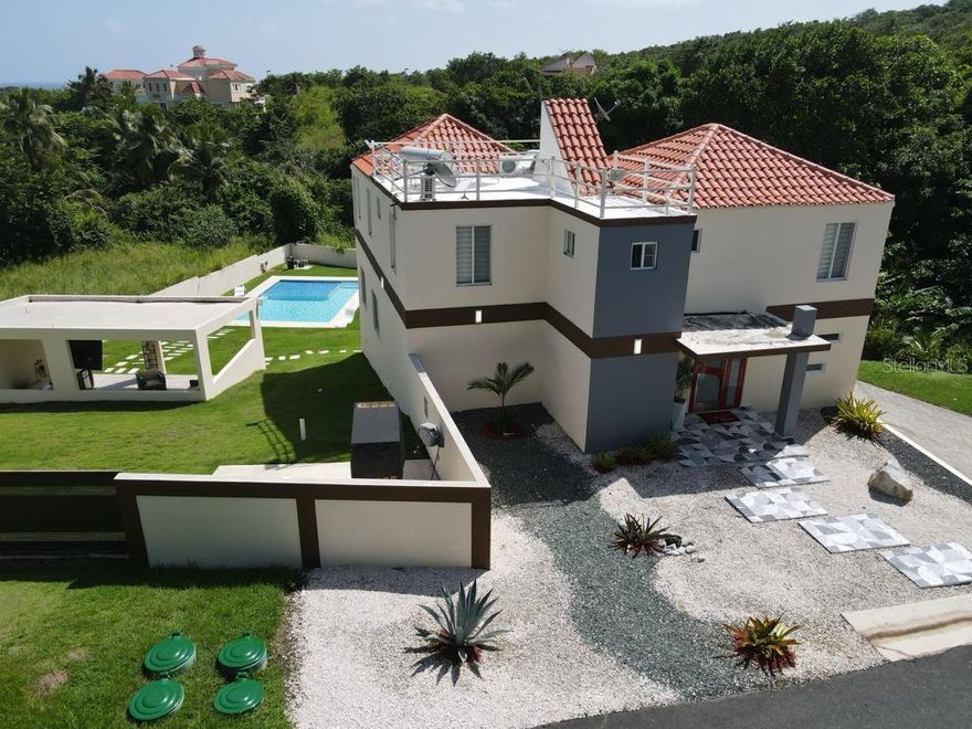 Enjoy the paradise at the Caribbean on this beautiful home of four ample bedrooms with three and a half baths surrounded by great location and coziness. An open space home that includes everything to share great memories with your family. Also can be lease on a short term basis as a great investment. It has an open concept layout taking in consideration natural light. You can cook great recipes on a new kitchen with granite countertops with lot of cabinets space. Amenities: pool table, casino's blackjack table, dining room, living room, laundry, family room, covered gazebo with tv and barbecue area. Some of the main points of this amazing home are the unique swimming pool with pristine waters, basketball court, a mini golf, sun decks, among different treasures that you will discover in every area. Generator and transfer switch included. Proof of funds and/or qualification letter will be requested to schedule showings.