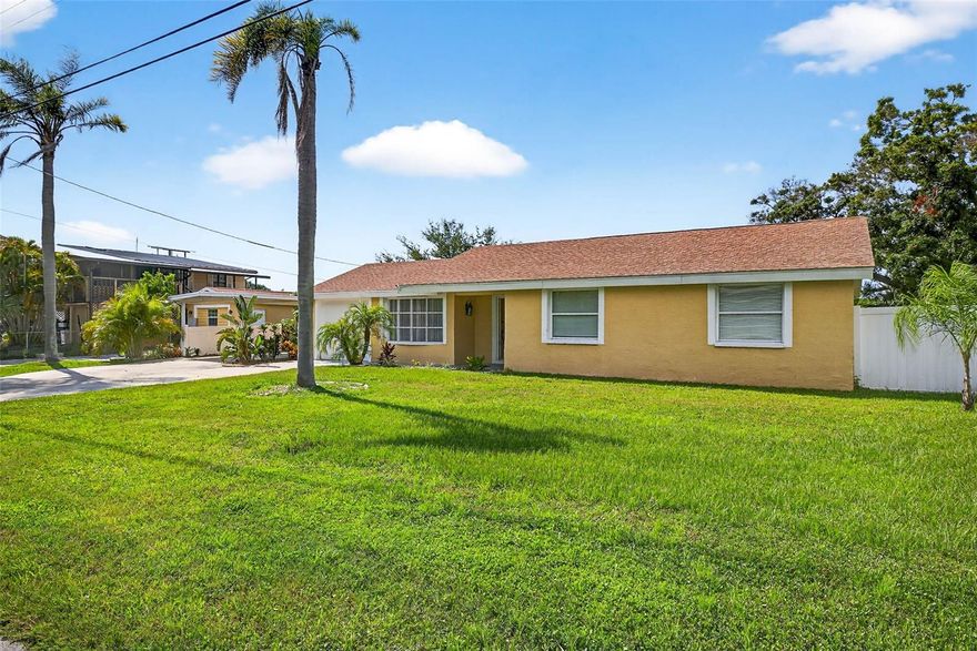 This Beautiful 2 home Waterfront property with spectacular views of a saltwater canal and mangrove forest with direct access to the bay. Welcome to your private paradise in sunny Florida! These homes come with a private saltwater dock and direct access to the bay. These serene private bungalows are nestled on a saltwater, mangrove canal. This stunning waterfront property offers a luxurious and relaxing retreat. As you approach the home, you'll be immediately struck by the lush tropical foliage and sparkling canal. The house features a classic Florida design with light stucco, ample parking, and tall palm trees swaying in the breeze. The gourmet kitchen features top-of-the-line appliances, granite countertops, The spacious dining area is the perfect spot to spread out with two separate living areas ibn the main house. The second house features a living area, a bedroom and a kitchenette and deck. The A/C system on the small home is new Split system. Lawn maintenance is included. There is a potential to lease the second home as an Airbnb for extra income. Lot is 100 feet width on the water!