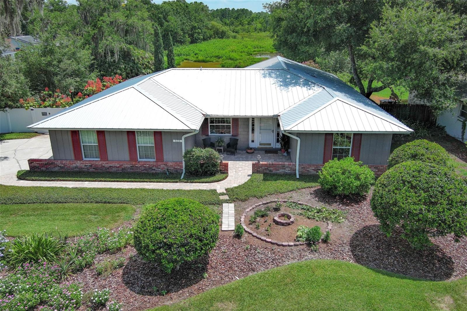 Tropical Paradise in Longwood – 4BR/2BA Pool Home on Conservation Lot!
Welcome to your private retreat, surrounded by lush conservation and wetlands—this secluded 4-bedroom, 2-bath home is a nature lover’s dream and an entertainer’s paradise!
Step inside to an inviting open-concept floor plan with a bright eat-in kitchen, featuring granite countertops, a center island, stainless steel appliances, a built-in smart oven and range top, and a beautiful stainless steel range hood—a perfect blend of style and function for any home chef.
The primary and guest bathrooms have been beautifully updated, and the home includes major upgrades like a metal roof (2017), Re-plumbed, energy-efficient double-paned windows and doors, and LeafFilter gutter guards for peace of mind. Beautiful faux wooden shades offer both privacy and a touch of elegance. Step outside to your tropical oasis with a screened-in lanai, paver pool deck, and a large saltwater pool with separate spa. Sip your morning coffee while listening to the birds on the covered lanai, take a dip in the pool, or relax around the chiminea on cool Florida evenings. When water levels rise, launch your kayak or canoe right from your backyard!
Additional features include an oversized side-entry garage ideal for hobbyists or extra storage, a paver front walkway for charming curb appeal, privacy fencing, and meticulously landscaped grounds.
All of this with optional HOA, close proximity to SunRail, I-4, Altamonte Mall, Seminole Wekiva Trail, top-rated Seminole County schools, medical centers, restaurants, and year-round Longwood city events.
Call today to schedule your private showing—this one-of-a-kind home won’t last!
