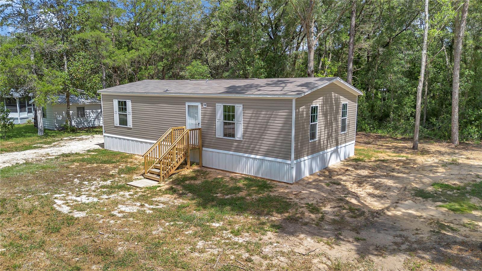 BRAND NEW MANUFACTURED HOME located in Rainbow Park. This home is cute as a button. Both bedrooms have large walk in closets. Guest bathroom has a shower tub combo and primary bedroom has a walk in shower. Brand new stainless appliances included. Corner lot and a short, easy drive from the paved road! Take advantage of this competitive pricing!!