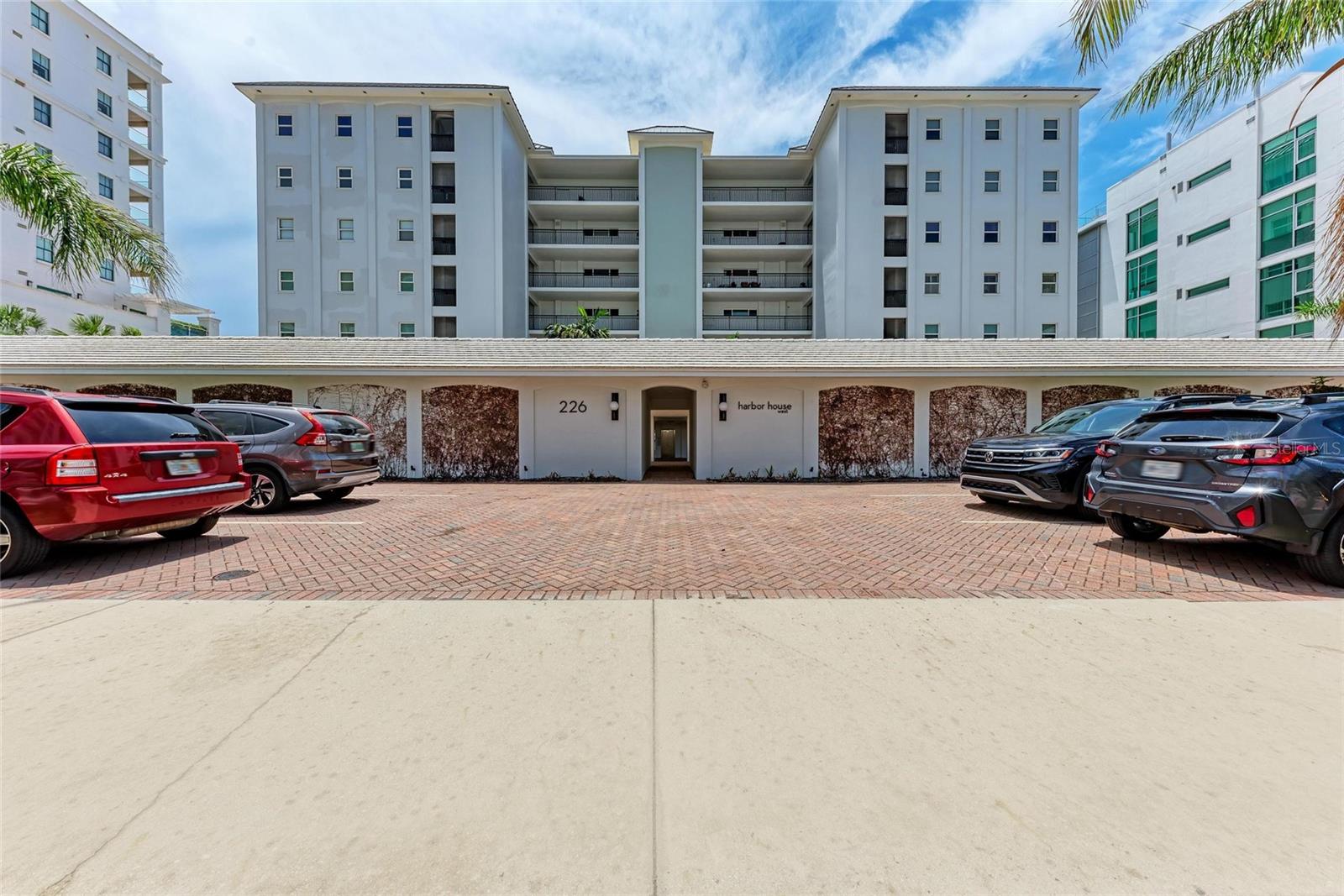 Commanding a prime corner position on Sarasota's most exclusive peninsula, this corner unit offers a rare blend of spacious elegance, refined privacy, and unforgettable sunset views. This beautifully furnished residence boasts a larger than standard foor plan with expansive glass showcasing wide, unobstructed vistas of Sarasota Bay and the iconic Ringling Bridge, a mesmerizing backdrop as the sun sets in vibrant color each evening. Natural light fills every inch of this sophisticated coastal retreat, where modern design meets timeless luxury. Just moments from downtown Sarasota's cultural venues, fine dining, and marinas, this one of a kind home delivers the ultimate in waterfront living.