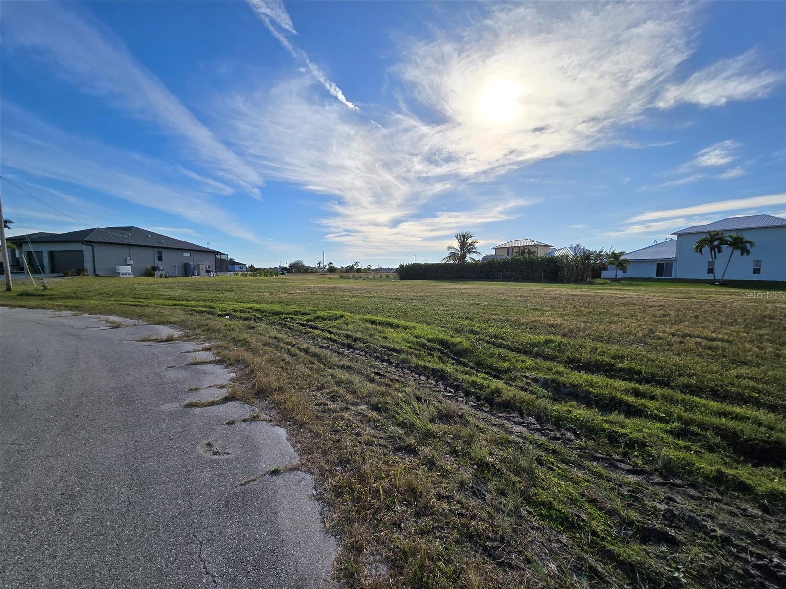 Discover the perfect blend of charm and potential with this spacious .56-acre lot in the desirable northwest Cape Coral area of Lee County, Florida! Situated at 3100 NW 1st St, this property offers a prime location to build the home of your dreams. With no HOA restrictions, you’ll enjoy the freedom to create a lifestyle that suits your vision, whether it’s a tranquil retreat or a vibrant family oasis. The endless possibilities of this blank canvas make it an opportunity you won’t want to miss. Don’t wait—your dream home begins here!