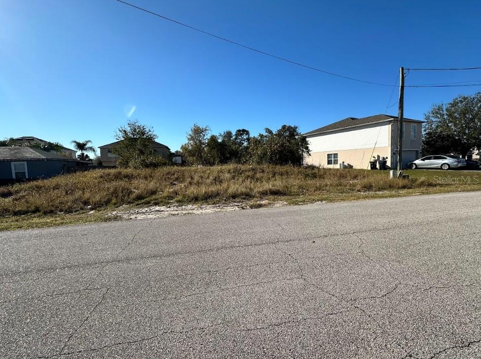 Situated in the heart of Poinciana this residential lot measures 77 by 100 feet and offers access to city water and sewer. Located outside the flood zone, with no wetlands, this lot is shovel-ready and primed for development. Seller financing, Low down payments, flexible terms up to 6 years, and fixed monthly payments. Quick approval with no banks. Build equity you can later use to build your home with us. Try our payment calculator online or call us to learn more about our financing options. Poinciana is the fastest-growing subdivision in Florida. It is down the street from Lake Marion Creek Wildlife and trailhead, 30 minutes to Disney World and Orlando attractions, 40 minutes to downtown Orlando and MCO airport, and just over an hour to Tampa. Providence Golf Club and Reunion Resort are nearby. The expansion of local hospitals, schools, and businesses makes this area the perfect place to start your new project. Plus, take Sunrail at Poinciana Station to the greater Orlando area and avoid the traffic. Lots have utilities accessible!