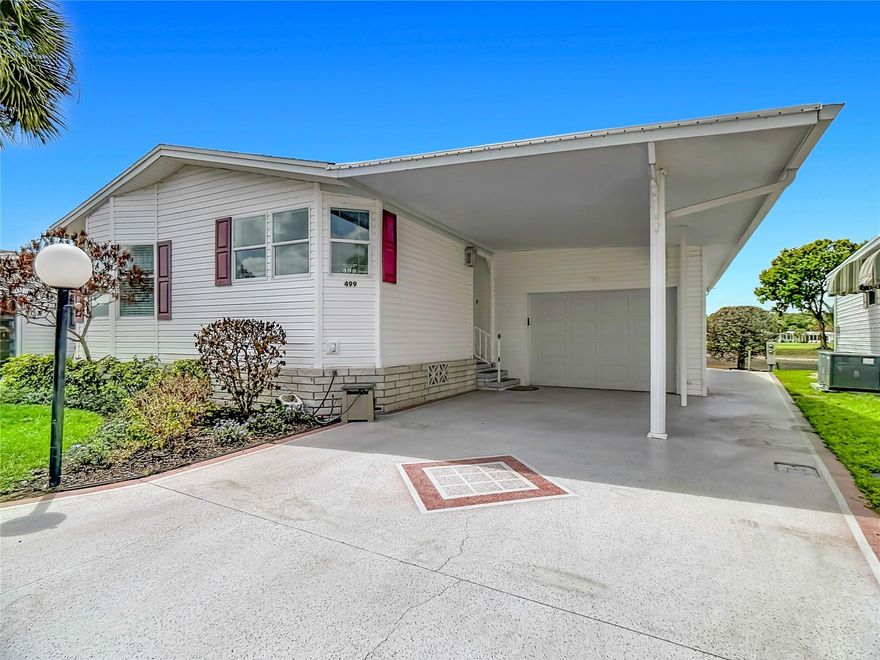 ***Price updated.  Incorrectly entered with wrong price

Beautifully furnished 2BR/2BA home overlooking the golf course and a peaceful pond in the sought-after Lily Lake Golf & RV Resort. The bright front kitchen features windows across the front of the home, flowing into a welcoming dining area and cozy den. The back of the home opens to expansive golf-course views through multiple windows, plus a patio perfect for Florida sunsets.

The layout includes a comfortable guest bedroom with nearby bath, an interior laundry area, and a spacious main bedroom with en suite. A rare one-car garage plus golf cart parking adds tremendous value.

Enjoy resort-style living in this golf cart community with a clubhouse, pickleball, tennis, shuffleboard, two dog parks, low POA fees, underground utilities, seasonal dances, golf cart parades, and year-round water aerobics. Golf cart rentals are available at the Lily Lake Pro Shop, where you’ll also find many scrambles and ongoing golf events. Bring your clubs, your cart, and your flip-flops — this is the Florida lifestyle at its best.