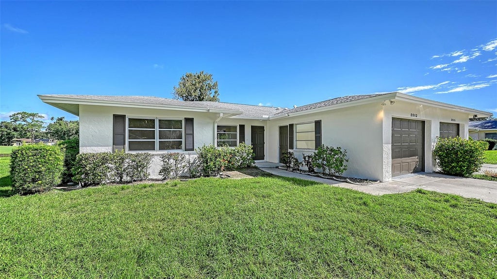 Photo of 5513 Palm Aire Drive, Sarasota, FL 34243 (MLS # A4706317)