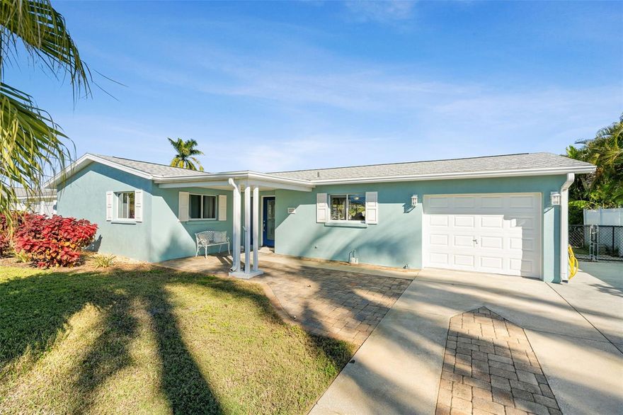 A rare deepwater opportunity in Bay Colony—Manatee County’s best-kept secret for serious boaters. This non-deed restricted waterfront community features the widest and deepest canals in the county, no HOA fees, and direct Gulf access—perfect for those who live life on the water. This fully updated 2-bedroom, 2-bath residence offers 1,519 square feet and sits directly on a deepwater canal, allowing you to keep your boat just steps from your back door. The property includes a 7,500-lb boat lift and a 22-foot dock—a rare setup in this price range. Enjoy tranquil canal views from the expansive backyard paver patio, designed for waterfront entertaining, morning sunrises, and sunset cocktails. A 220-volt outlet is already in place for a hot tub, enhancing the outdoor living experience. Inside, the home has been completely renovated featuring white quartz countertops, custom white cabinetry, and premium stainless-steel appliances. Original terrazzo flooring preserves mid-century character, while updated spa-inspired bathrooms elevate the space. Recent capital improvements within the past year include a new roof, new HVAC system, new water heater, and new irrigation pump. A large canal-view storage room offers flexible use as an office, captain’s room, or gear storage. Hurricane shutters provide added security. Conveniently located near I-275, I-75, US-41, US-301 and the Skyway Bridge, offering quick access to St. Petersburg, Tampa, Sarasota, Bradenton, and open water.  Boating season is just around the corner, so hurry and put this one on your list today, before another buyer is enjoying your lifestyle in your house!