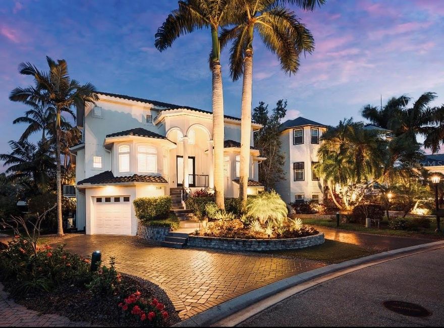 Introducing a Luxury Waterfront Residence in Hawks Harbor. Welcome to an exceptional luxury residence located in the prestigious, gated waterfront community of Hawks Harbor. Offering an unparalleled lifestyle, the home features four bedrooms and four and a half bathrooms, perfectly designed for both comfort and sophistication. Upon entering, a wall of windows and soaring ceilings fill the great room with an abundance of natural light. The open-concept floor plan flows into a recently updated kitchen, which showcases quartz countertops, new appliances, a butler’s pantry, and both casual and formal dining areas. The main level includes a spacious primary suite and a second en-suite guest bedroom for optimal convenience. Upstairs, two additional en-suite bedrooms open onto a private 21-foot balcony, offering tranquil views and a perfect retreat for your guests. The property boasts a spacious pool and hot tub area, ideal for relaxation and entertaining. Situated amongst lush tropical landscaping, the home is its own private oasis. The residence also includes an air-conditioned five-car garage with epoxy floors, abundant storage, and a dedicated workshop - perfect for the car enthusiast. The private dock is equipped with a 16,000 lb lift, providing seamless access to Sarasota Bay, the Gulf of Mexico, and the Gulf Coast’s award-winning beaches.
An elevator services all three levels, ensuring ease and comfort throughout the home. Step outside to enjoy the saltwater, heated pool and spa, a retractable screened lanai, and mature plantings that enhance the outdoor living experience. The home has been thoughtfully renovated, featuring a completely remodeled kitchen and bathrooms, new tile flooring, carpet, lighting, and hardware throughout. Plantation shutters and UV-tinted windows add comfort and energy efficiency. The garage has been upgraded with epoxy floors, LED lighting, and custom cabinetry. Dock and patio enhancements, resurfaced pool and spa with new tile, pump, and jets, new pavers, and over 30 low-voltage landscape lighting fixtures further elevate the property’s appeal. Ideally situated just minutes from downtown Sarasota, the home provides direct access to world-renowned beaches with no bridges between you and open water. The prime location of Hawks Harbor offers convenient proximity to Sarasota Airport, fine dining, shopping, Sarasota’s world-renowned arts, performance, and entertainment, St. Armand's Circle, Anna Maria Island, Lido Key, IMG Academy, and a host of other amenities in Sarasota and Bradenton.