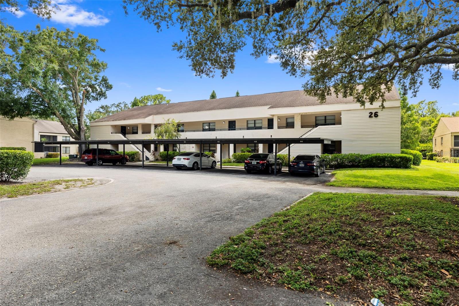 Welcome to River Oaks—Tampa’s hidden gem nestled along the peaceful Hillsborough River. This updated second-floor 1-bedroom, 1-bath condo is located in a private, guard-gated community featuring two sparkling pools, lush tropical landscaping, and unbeatable convenience to everything the city has to offer. Inside, you’ll find vaulted ceilings, brand new luxury vinyl plank flooring, and a bright, open living space that flows into a screened-in balcony with serene views of mature trees—a perfect spot to unwind. The kitchen offers plenty of prep space, while the central A/C and in-unit stackable washer and dryer add everyday ease. The spacious primary bedroom features a large walk-in closet, providing both comfort and functionality. Plus, an assigned covered parking space sits just outside for added convenience. With quick access to I-4, I-275, USF, local dining, and shopping, this location works for just about any lifestyle. Whether you're looking to live in it full-time or enjoy it as a weekend retreat, this upgraded unit in the gated River Oaks community is a must-see.