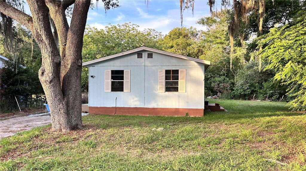 Photo of 1203 Parkwood Avenue, Groveland, FL 34736 (MLS # O6414674)