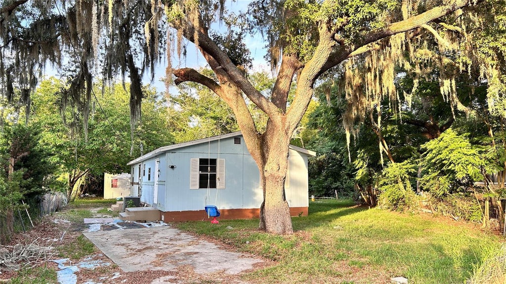 Photo of 1203 Parkwood Avenue, Groveland, FL 34736 (MLS # O6414674)