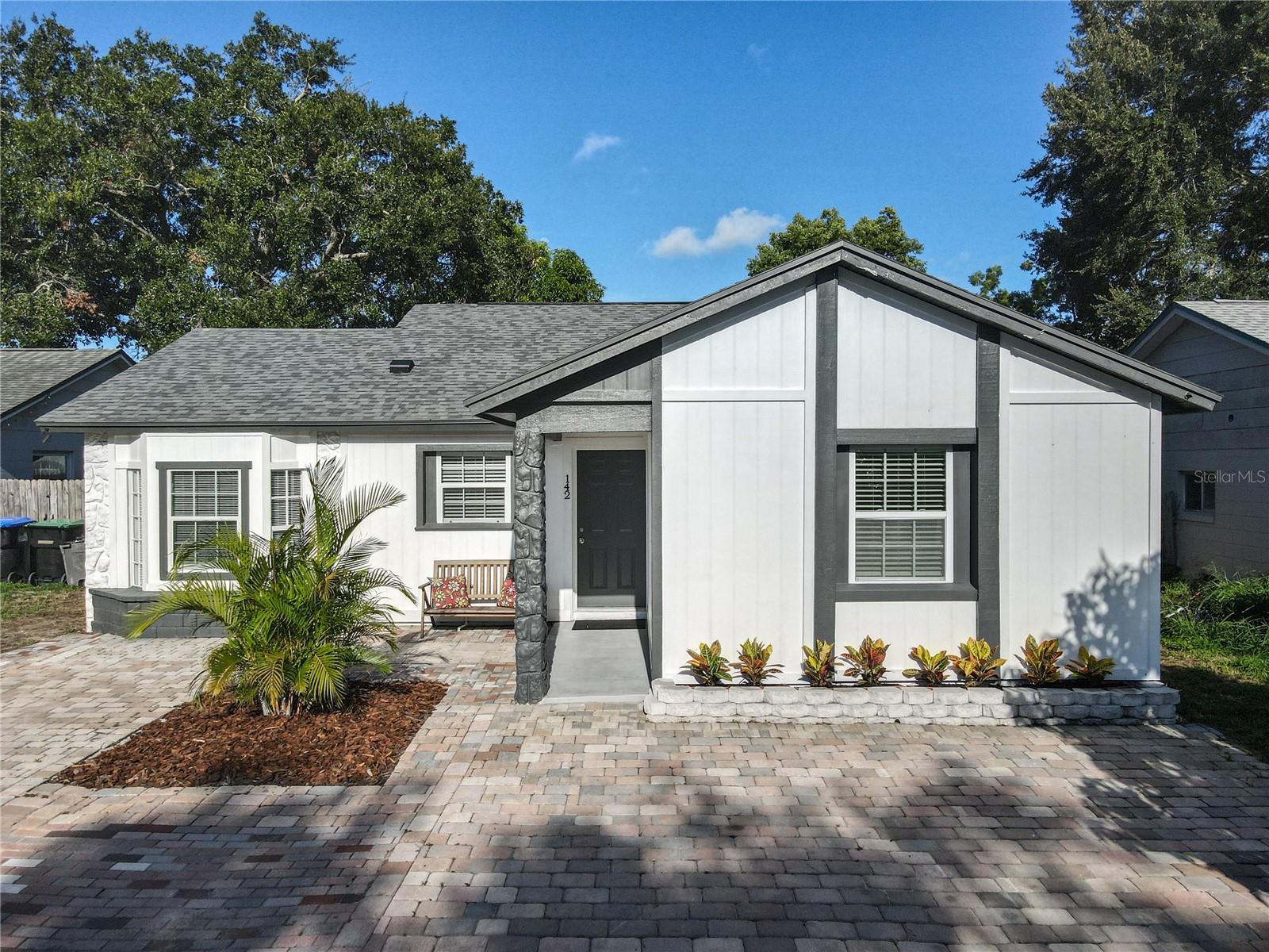 Fall in love with this adorable, move-in ready home where modern luxury meets life’s simple pleasures. This 3-bedroom, 2-bath beauty offers 1,492 square feet of stunning living space, completely reimagined in 2023 and enhanced with additional upgrades in 2025. From the moment you arrive, the freshly painted exterior, pavered driveway, attractive landscaping, and charming curb appeal set the tone for what’s inside. Step through the front door into a bright, open layout with vaulted ceilings and luxury vinyl plank flooring throughout. The fully remodeled kitchen features gleaming stainless steel appliances, white cabinets, granite counters, and a custom island. This chic home layout makes both cooking and entertaining a joy, with a great room for living and dining, and new sliding doors opening to your private backyard—perfect for family gatherings, morning coffee, or simply unwinding after a long day. Then retreat to your spacious primary suite, complete with a beautifully updated en-suite bath. Two additional bedrooms offer flexibility for family, guests, or a home office. And this home also features a comfy family room for game night, watching a movie, or enjoying the big game with friends on TV. Every inch of this home has been thoughtfully updated including - New Roof 2023, New AC 2023, New Water Heater 2023, New Sliding Doors 2023, New Blinds 2023, fresh Paint Inside 2025 and Out 2023, and whole house Re-Pipe 2025 - ensuring peace of mind and low-maintenance living for years to come. It's BETTER than NEW! Located in the desirable Windermere area, you’re just minutes from top-rated schools, upscale shopping, fine dining, and major highways for an easy commute. This is more than a house—it’s a place to create lasting memories in comfort and style. Come Discover your Best Life in this handsomely updated Home and experience why the locals love to call West Orlando HOME!