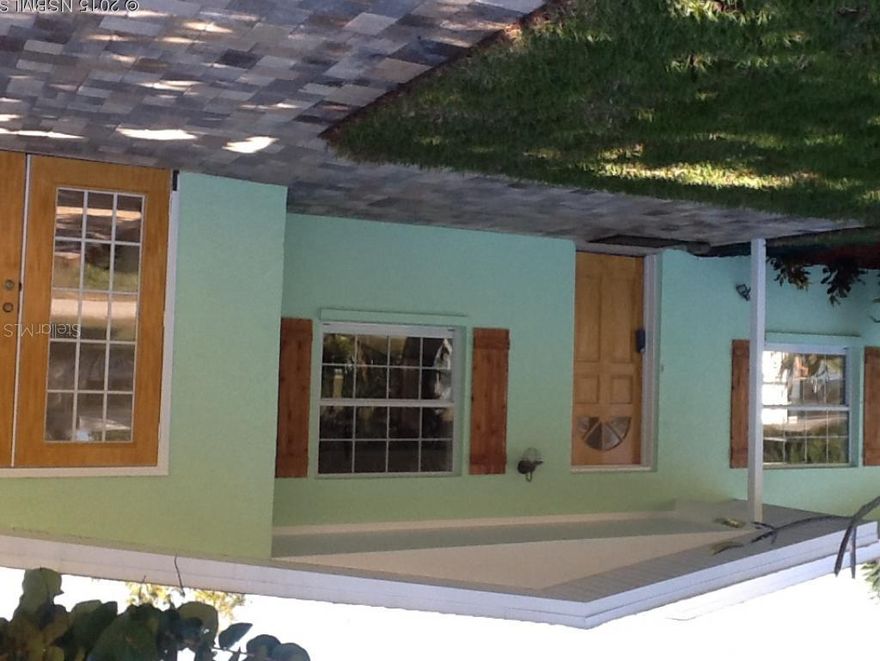 Beautifully updated 3/2 North Beach home. Beautiful open kitchen with all new wood cabinets, granite counter tops, stainless appliances, under cabinet lighting.  Absolutely beautiful terrazzo floors throughout.  New outside A/C, sunroom or office off of the living room, large laundry room, new pavers in the driveway, large lot.  Located on a quiet street walk to the beach or river. ;Water: City