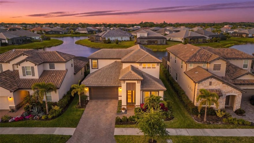 Tucked inside the gated community of Worthington in East Sarasota, this lakefront pool home offers a side of Sarasota that many buyers do not even realize exists. Quiet streets, natural surroundings, and newer construction come together to create a setting that feels removed, yet remains just minutes from everything that makes Sarasota so desirable.

Built in 2022 and offering over 3,000 square feet of thoughtfully designed living space, this residence delivers the perfect balance of function, flexibility, and lifestyle. From the moment you walk in, you are greeted by clean lines, tile flooring throughout the main level, and a layout that flows effortlessly from one space to the next.

The kitchen is designed for both everyday living and entertaining, featuring white cabinetry, quartz countertops, a large center island, natural gas cooking, and stainless steel GE appliances. It opens seamlessly into the main living area, creating a bright and connected space that feels both comfortable and inviting.

The primary suite is privately positioned and takes full advantage of the home’s lakefront setting, offering peaceful water views, a tray ceiling, upgraded lighting, and a spacious bathroom complete with dual vanities, a fully tiled walk in shower, and a custom built in closet system.

Flexibility is a key feature of this home, with a downstairs den that works perfectly as a home office and an upstairs bonus space that can be tailored to fit your lifestyle, whether that is a media room, gym, or additional living area.

Step outside and the home truly comes to life. The saltwater pool, complete with an electric heater, overlooks a wide lake view framed by natural landscaping for added privacy. With its west facing exposure, this is the kind of backyard where sunsets become part of your daily routine.

Worthington is a newer gated community known for its quiet atmosphere and low density design, offering a more private alternative to larger master planned neighborhoods. With no CDD fees and a location just east of I 75, residents enjoy quick access to Waterside at Lakewood Ranch, UTC shopping and dining, and some of Sarasota’s favorite local spots. Stottlemyer’s Smokehouse, the Celery Fields, and Big Top Brewing are all just a short drive away, making it easy to enjoy live music, outdoor activities, and local craft culture without going far from home.

This is a rare opportunity to own a move in ready lakefront pool home in one of Sarasota’s most underrated communities, where space, privacy, and convenience all come together.