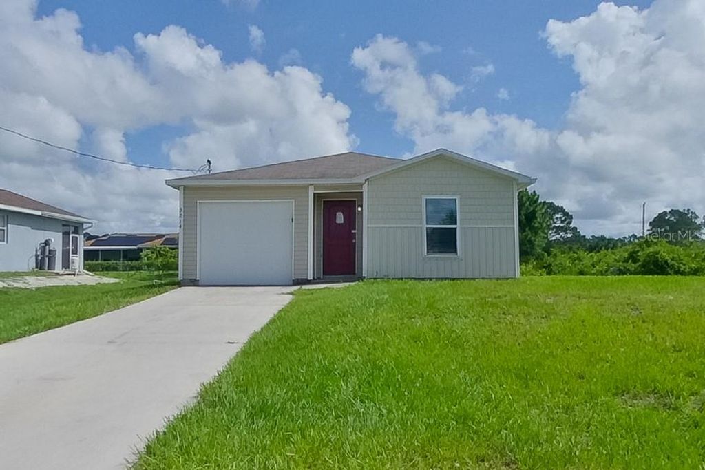 Photo of 3214 65th Street W, Lehigh Acres, FL 33971 (MLS # O6363856)
