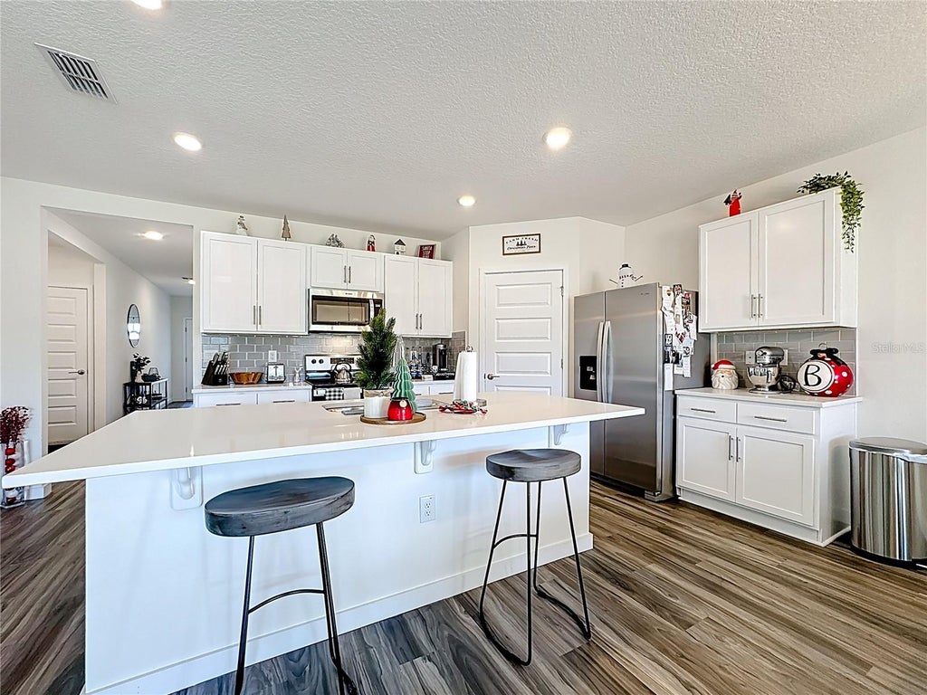 Photo of 348 Talisi Loop, Saint Cloud, FL 34771 (MLS # O6437189)