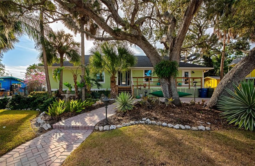 This luxury waterfront estate on Phillippi Creek is ideal for boaters, offering direct intercostal access, four bedrooms, and the largest square footage under $1.5M among current listings. Located on a peninsula, just minutes from Sarasota Bay and Siesta Key, the home features stunning water views, a peaceful cove, and beautiful sunsets.
Recent renovations include a new roof, HVAC, electric, plumbing, hurricane-impact windows, and energy-efficient spray foam insulation. The bathrooms and chef’s kitchen have been meticulously updated with high-end fixtures including Kohler rain showerheads, handheld wands and body jets, Viking appliances and KitchenAid double wall ovens and wine fridge. The living room has extensive water views, a gas log fireplace and soaring cedar-beamed ceilings creating a dramatic yet warm architectural statement, while honed marble floors extend throughout.
Two bedrooms have private entrances—perfect for guests or home office. The primary suite provides serene water views without leaving the comfort of your bed.
Enjoy seamless indoor-outdoor living with multiple entrances to the screened lanai and deck. Outdoor enthusiasts will appreciate the private dock, with water and electric, providing quick access for boating, kayaking, and paddleboarding to the Bay and Siesta Key beach. Ideal for fishing and daily wildlife sightings, including manatees and abundant birdlife.
Centrally located, minutes to downtown (3.7 miles), Siesta Key Beach (2.1 miles) and SRQ Airport (7.7 miles), this rare offering presents an outstanding luxury waterfront residence or high-end rental investment for boaters, beach goers, and nature lovers alike.
Only 15 properties are available on this peninsula, making homes in this secure, HOA-free, close-knit community rare when listed.  A truly unique Sarasota waterfront opportunity.