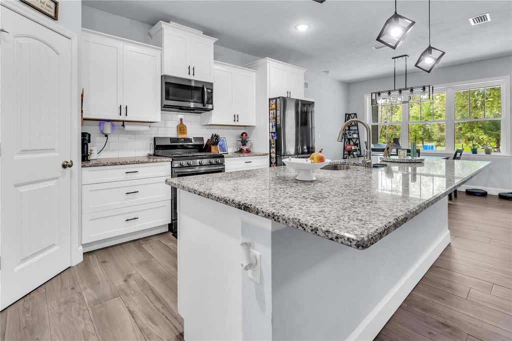 Photo of 8069 NE 8th Place, High Springs, FL 32643 (MLS # GC541997)