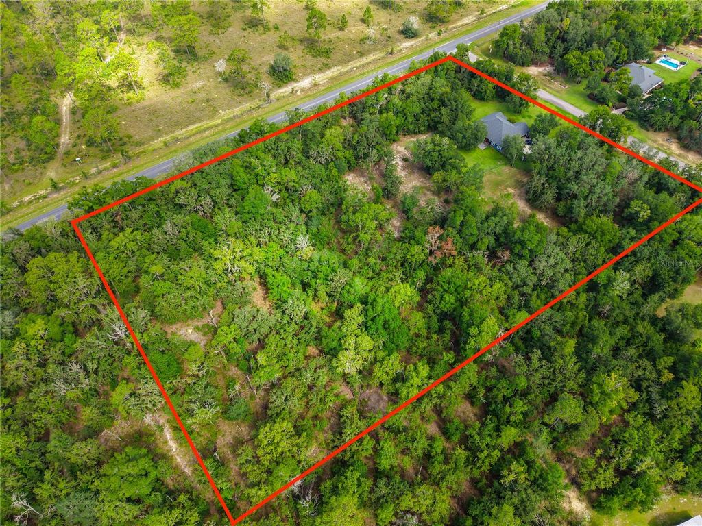 Photo of 8069 NE 8th Place, High Springs, FL 32643 (MLS # GC541997)