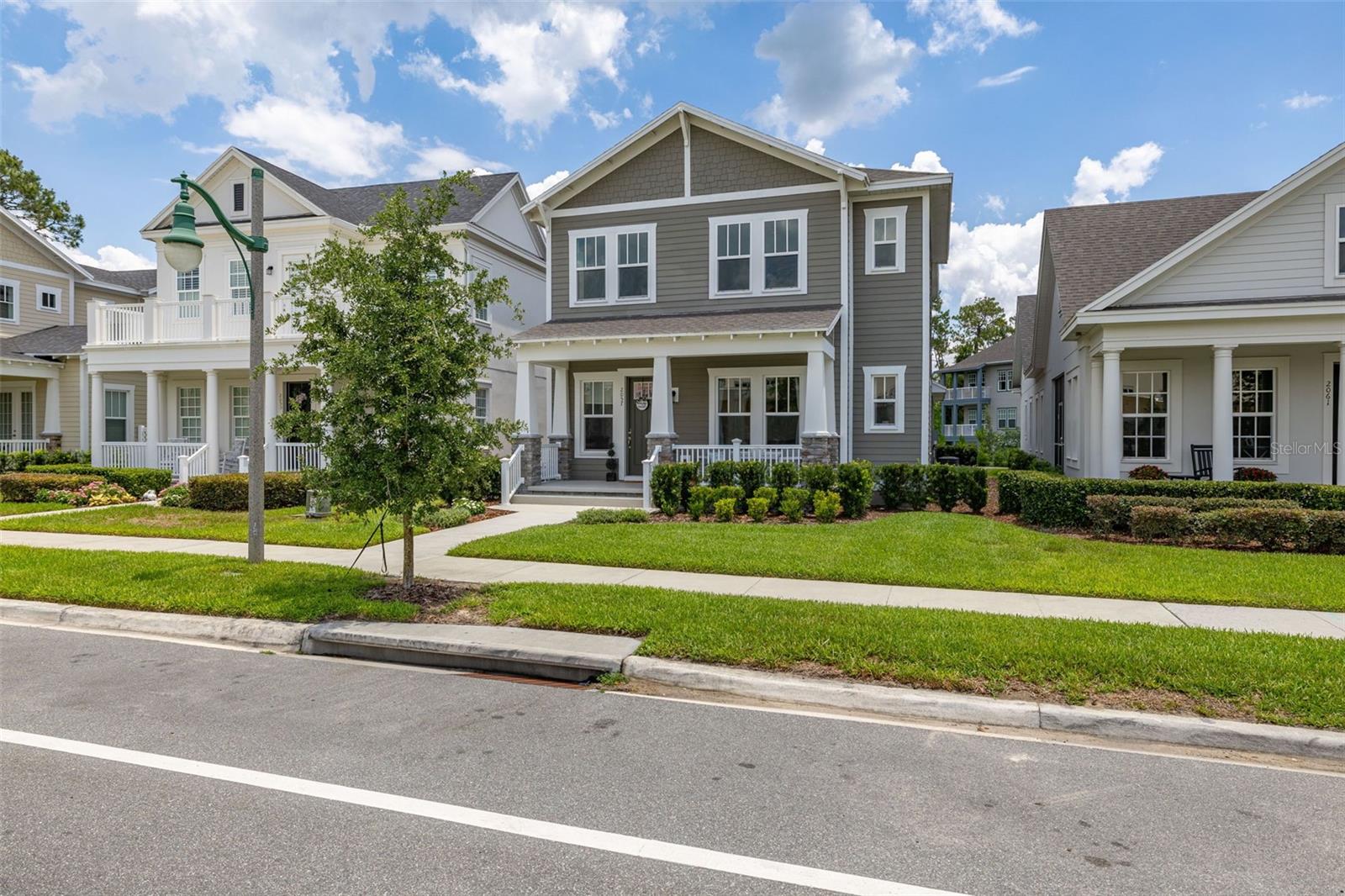 Welcome to an exquisite residence nestled in the heart of Island Village, Celebration. This elegant home offers an open and modern living experience with spacious flex and entertaining areas abound. LOCATED with CONSERVATION behind the property creating the beauty of nature. Step inside to discover a seamless blend of style and functionality. Upon entering the grand two story foyer entryway, one notices 12x12 ceramic tile flooring laid in brickwork vertical offset pattern, 5 inch baseboards, 8 foot high doors, dual pane windows and recessed lighting throughout. Just off the foyer is the first floor Office/5TH BEDROOM with walk in closets, the perfect flex space to suit your needs. Moving towards the heard of the home, one is greeted by the large living area with open floorplan design, plenty of natural light and ease of access to kitchen and outdoor spaces, an entertainers dream. The kitchen features alabaster colored 42 inch cabinets with brushed nickel pulls, pure white quartz counters with waterfall edge finish, blanco wave style subway tile backsplash and a single basin undermount sink with gooseneck faucet and filter tap. The stainless steel double oven, 4 burner gas stove, French door refrigerator and dishwasher complete this chefs paradise. The adjoining dining area and kids zone nook flows effortlessly making it ideal for both entertaining and cozy gatherings. Just off the dining area is the lanai overlooking the oversized side and backyard area, a premium in Celebration. As you head upstairs, the loft area provides a secluded hang out spot for those wanting a little getaway. The primary suite is adorned with tray ceiling with recessed lighting, oversized walk-in closet and primary bath perfected with gentlemen's height dual vanity, brushed nickel pulls, quartz countertops, square cut undermount sinks, dual handle faucets and walk-in shower with tile to the ceiling. Down the hall you'll find the secondary bathroom flanked by bedrooms 2, 3 and 4. The secondary bathroom is also embellished with gentlemen's height dual vanity, brushed nickel pulls, quartz countertops, square cut undermount sinks, dual handle faucets and tub/shower combo. Just one block from Downtown Island Village shops and restaurants, enjoy the community amenities, gym, pool and over 26 miles of Celebration's Nature Trails. This home also provides easy access to all that Celebration has to offer, only 1 mile to the new Shops at Celebration Pointe, 4 miles to Market Street, and less than 15 minutes to Magic Kingdom. This perfect blend of modern elegance and thoughtful design awaits your presence.