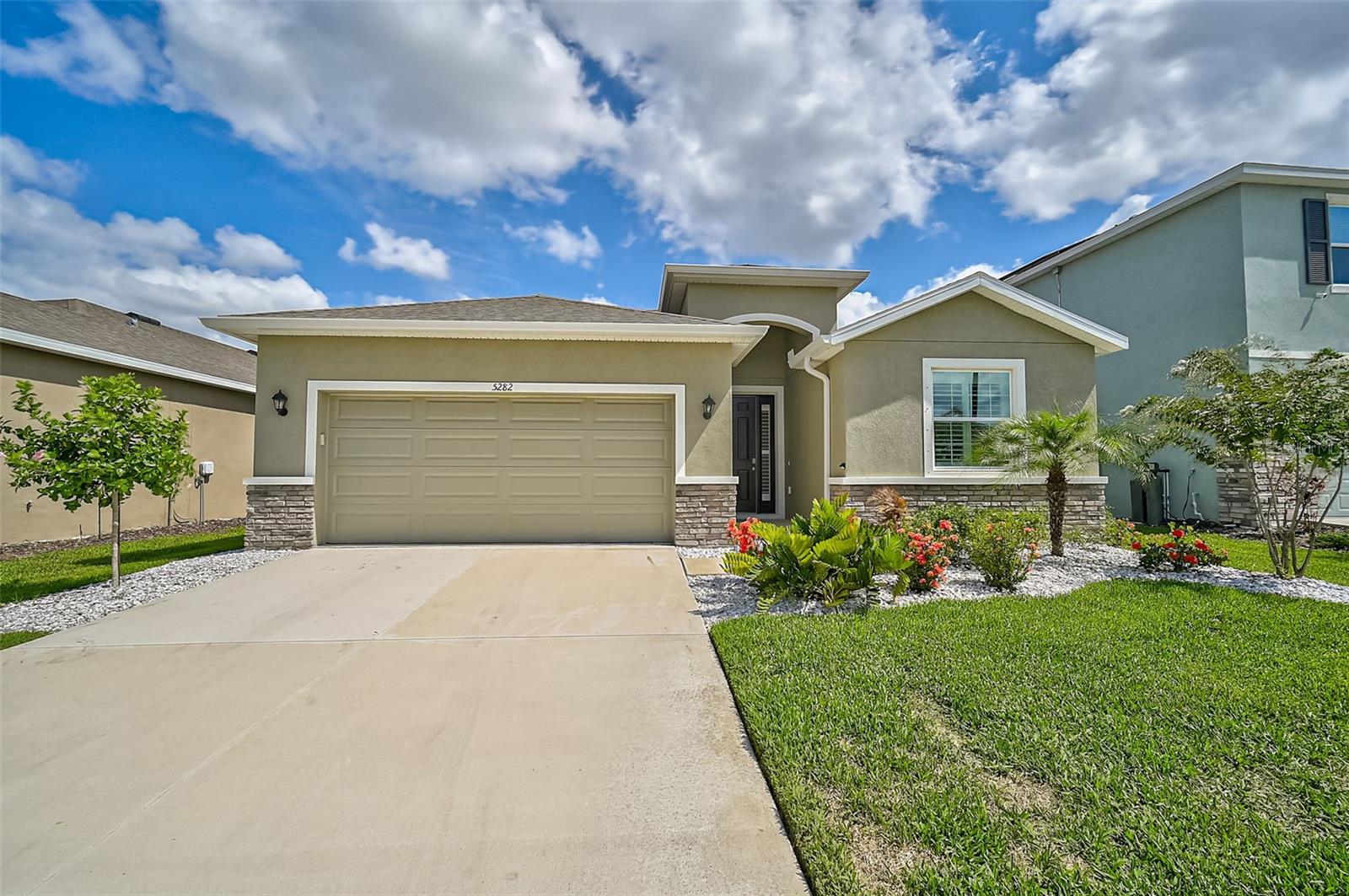 BETTER THAN NEW WITH THOUSANDS OF UPGRADES ALREADY DONE FOR YOU! SAVE THOUSANDS WITH AN ASSUMABLE 4.75% MORTGAGE AND LOW CLOSING COSTS! This well-maintained home, nestled in a vibrant and friendly community, offers a blend of comfort and convenience that caters to every facet of modern living. With a generously sized 2056 sq ft layout, this home features 4 bedrooms and 2.5 bathrooms, providing ample space for families, entertainers, and home office enthusiasts alike. The interior of the home is illuminated by natural light, showcasing the beautiful PLANTATION SHUTTERS that provide both privacy and style throughout. The attention to detail is immediately apparent, with high-value upgrades including a WHOLE HOUSE WATER FILTRATION SYSTEM, ensuring pristine water quality for you and your loved ones. The heart of the home is the kitchen, which boasts modern appliances such as a NEW WHIRLPOOL REFRIGERATOR, complemented by cabinets with crown molding, a walk-in pantry, tiled backsplash, and breakfast bar seating. It opens up to a spacious living area, complete with sliders that lead out to a SCREENED LANAI - the perfect setting for relaxation or entertaining guests and a FULLY FENCED BACK YARD. The primary suite is a true retreat, featuring a tray ceiling, recessed lighting, and an ensuite that promises to be your own personal spa. Additionally, the property enjoys the benefits of a maintenance-free yard, front gutters, a sink in the garage for convenience, and hurricane shutters for peace of mind. Living here means you’re also part of a fantastic community with access to a pool and playground, perfect for fun days without leaving the neighborhood. Don't miss the opportunity to create endless memories in this beautiful home, where every detail has been considered for your utmost comfort and convenience.