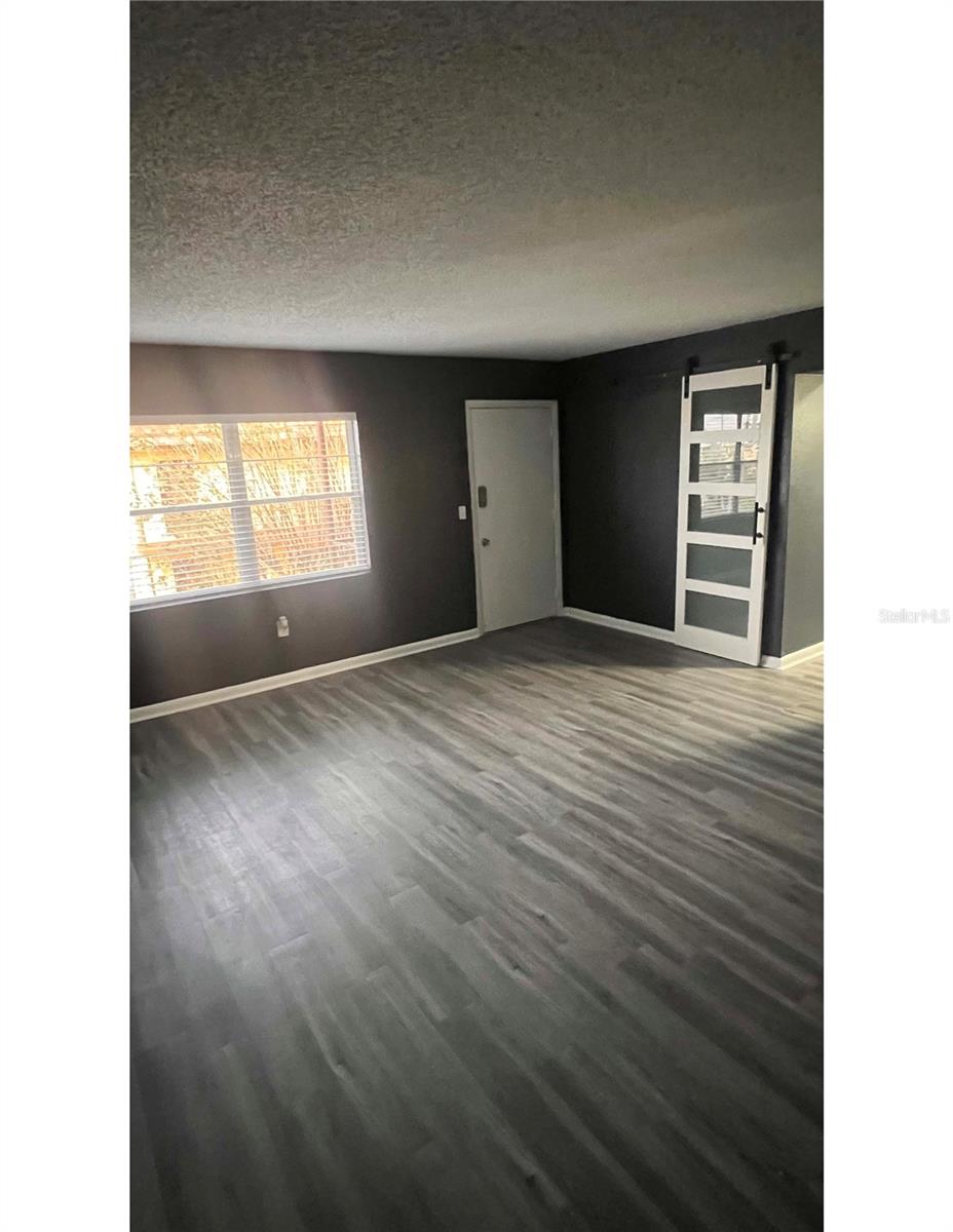 Welcome to your newly renovated condo! A small room, in addition to the other 2 bedrooms, has a beautiful sliding barn door greeting you as you first enter. The luxury vinyl plank flooring dazzles throughout the space. The kitchen is picturesque for your culinary delights. Uniquely painted walls make this condo feel luxurious and right at home. Schedule your tour now!