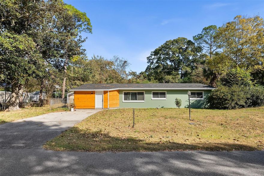 Beautifully remodeled and well-maintained, this charming home is located in the quaint Southside Terrace neighborhood of High Springs, just minutes from Highway 441 and downtown, where you can enjoy local restaurants, coffee shops, boutiques, bars and all the small-town charm. Featuring a 2025 roof, newer AC and water heater, updated windows, copper plumbing and freshly completed interior renovations, this home is move-in ready. As you enter through the front door, you are greeted by a convenient mudroom ideal for storing backpacks, coats and shoes. The space opens to a spacious great room and dining area, anchored by a beautifully updated kitchen with brand-new stainless steel appliances, pantry cabinet and a sink overlooking backyard. French doors from the dining area lead to a sunroom, with a laundry nook located just to the side. The home offers wood-look tile flooring throughout with no carpet, updated lighting and fan fixtures, and freshly painted walls with tasteful finishes. Both bathrooms have been fully remodeled and feature stylish vanities, marble-look tile and updated plumbing fixtures. Each bedroom is equipped with ceiling fans and window blinds. This property blends comfort and character with a functional layout and thoughtful updates, offering a wonderful opportunity to enjoy the lifestyle that High Springs has to offer. Call today!