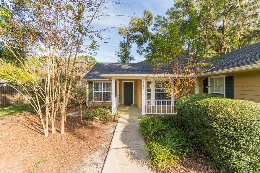 Welcome to your new home in Mentone! This charming former model home sits on a prime location, featuring an inviting open-concept floor-plan and perfect spaces for outdoor gatherings. The kitchen serves as the heart of this home, seamlessly connecting to the dining room (or potential home office), breakfast nook, and expansive great room. Slide open the glass doors to reveal a covered patio and a fenced yard adorned with a custom paver seating area perfect for entertaining, a fruitful grapefruit tree and easy-to-maintain, Florida-friendly landscaping. Vaulted ceilings flood the space with natural light, complemented by chair rail and crown molding accents. Enjoy the comfort of the newly laid luxury vinyl plank flooring throughout most of the home, with sleek tile in the remaining areas. The owner's suite has high ceilings, a spacious walk-in closet, and a generously sized bathroom featuring a jetted tub and shower. The entire home has been freshly painted both inside and out. This energy-efficient home is equipped with double-paned windows and a HEPA filter HVAC system. Mentone itself offers a range of amenities, including a pool with lap lanes and a kiddie pool, a playground, tennis courts, trails, and sidewalks. Enjoy the convenience of being just 5 miles from UF and a mere 3 miles from Celebration Pointe, providing many options for dining, shopping, and entertainment. Mentone also offers direct access to the Archer Braid bike trail. Keep utility costs in check with GRU covering water, sewer, trash, and gas, while Clay Electric takes care of power. Choose between Cox and AT&T U-verse fiber optic internet, both offering gigabit connections for seamless home office functionality. Your Mentone residence combines comfort, style, and practicality in a location that truly caters to a modern lifestyle. First, Last, and Security Deposit required.