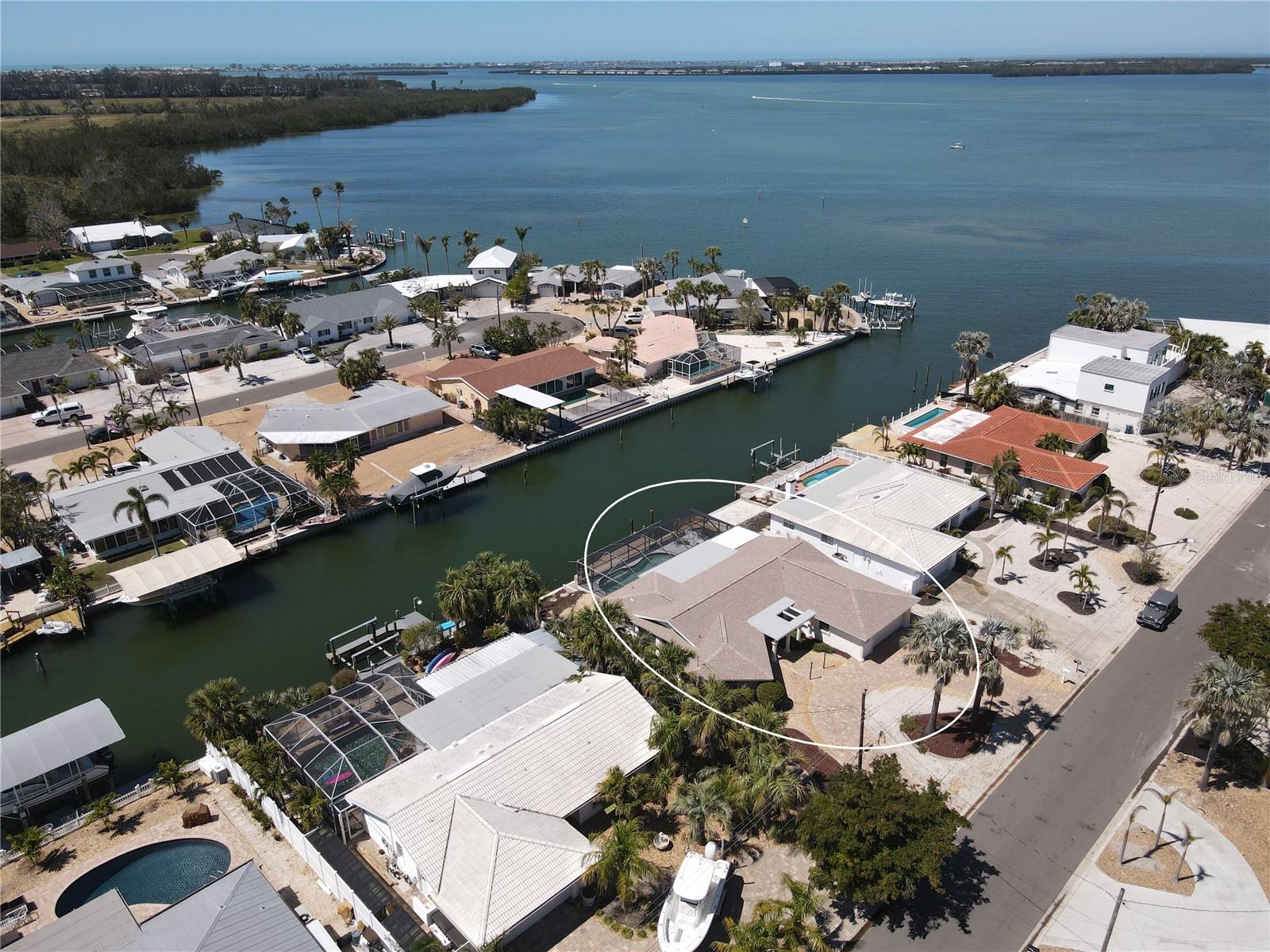 Back on the Market as Buyer Financing Fell Through. PRICE IMPROVEMENT On Million Dollar Views! Welcome to your waterfront retreat in San Remo Shores, a lovely neighborhood in Bradenton! This Deep Water, Saltwater canal-front home sits near the end of a quiet cul-de-sac, offering quick and easy access to the azure waters of Sarasota Bay and the Gulf of Mexico— with no fixed bridges- a true paradise for boaters and water enthusiasts.
Inside, this well-maintained home features terrazzo floors in the main living areas, a 2024 roof, and 2025 impact multi-slide patio doors, providing both storm protection and a seamless indoor-outdoor flow. Air Conditioner from 2019. The spacious living room and formal dining room offer plenty of room for relaxation and entertaining. The kitchen is equipped with a 2025 built-in oven, newer dishwasher, and a cozy eat-in area. Additional conveniences include a separate laundry room and a spacious garage for extra storage.
The home boasts a bright and airy Florida room with 2025 luxury vinyl flooring, and a Built In Murphy Bed, offering a comfortable indoor space to enjoy the Bay and Canal views. Outside, a newly refurbished screened outdoor area with 2025 Flat Roof leads to the large in-ground pool, making it perfect for year-round relaxation and entertaining. The dock features 2025 wood treads, adding both safety and style for easy waterfront access. The 2025 installed pavers along the canal wall enhance both the beauty and functionality of this prime waterfront property.
Voluntary HOA means you can AirBNB, making this home a Great Investment Opportunity!
While the Florida room did experience minor water intrusion from Hurricane Helene, it has been fully remediated, and no home or flood insurance claims were filed.
Don't miss this opportunity to own a piece of paradise in San Remo, where boating, beaches, and swimming await you. Just minutes from Sarasota Bay and the Gulf of Mexico, and Minutes by Car or Bike to the Beautiful Sandy Beaches of Anna Maria Island! —schedule your showing today!
