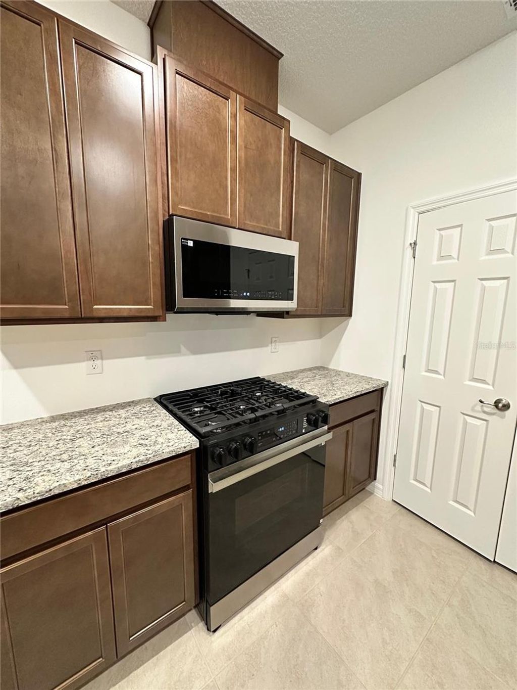 Photo of 7004 Broad Wing Loop, Howey In The Hills, FL 34737 (MLS # O6368222)