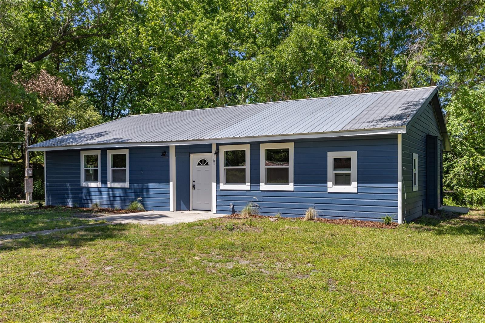 Completely updated home on a corner lot in Starke! Enjoy peace of mind with a brand new HVAC (2025), new kitchen, new bathrooms, fresh interior/exterior paint, and all new flooring throughout. The metal roof is in great condition, offering long-term durability. This move-in ready home blends modern updates with solid construction—perfect for homeowners or investors alike. Don’t miss this one!