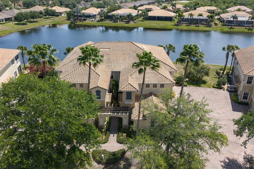 TAKE THE VIRTUAL TOUR and see what an incredible opportunity this is to own your own slice of paradise and enjoy carefree living in Toscana at Renaissance in Sun City Center! This beautifully maintained Tavarnelle condominium offers 3 bedrooms, 2 bathrooms, plus a den, all thoughtfully designed within an open-concept floor plan and enhanced by a peaceful water view.  Just steps away from Club Renaissance. Being sold fully furnished-turnkey, this gently used, one-owner home is truly move-in ready. Access is easy via stairs or your private in-home elevator, maintained by the association. Once inside, you'll be welcomed by a spacious great room featuring soaring 12-foot ceilings, elegant architectural archways, updated lighting, ceiling fans, and an abundance of natural light. Multiple sliding glass doors create seamless indoor-outdoor living, leading to a covered, screened lanai overlooking a tranquil pond perfect for relaxing or entertaining. The chef's kitchen is both stylish and functional, showcasing 42" wood cabinetry, solid surface countertops, black appliances, a walk-in pantry, breakfast bar, and a cozy dinette area. Ceramic tile flooring runs throughout the main living areas, with carpeting in the bedrooms and den for added comfort. The primary suite is a private retreat with direct lanai access, a tray ceiling, walk-in closet, and serene water views. The en-suite bath features dual vanities with solid surface counters, a custom glass-block walk-in shower, private water closet, two additional closets, and updated fixtures. A split-bedroom layout ensures privacy, while the secondary bedrooms and den offer flexible space for guests or a home office. Additional highlights include a two-car garage, a laundry room with built-in cabinetry and storage, and generous storage throughout the home. Residents enjoy  your social membership at the Club Renaissance, featuring a private pool and hot tub, restaurant, bar, fitness center, indoor track, golf shop, wellness center, and spa services. Live your best life in Sun City Center named Americas #1 Retirement Community for 2024 by Realtor and Travel + Leisure. Enjoy access to heated pools, a state-of-the-art fitness center, golf courses, sports complexes with tennis, pickle ball courts, horseshoes, softball field, clubhouses, arts and crafts, entertainment, and over 150 social clubs all easily accessible by golf cart. Conveniently located near Tampa, St. Petersburg, Sarasota, beautiful Gulf beaches, airports, shopping, and fine dining. Schedule your private showing today and start living the Florida lifestyle you've been dreaming of!