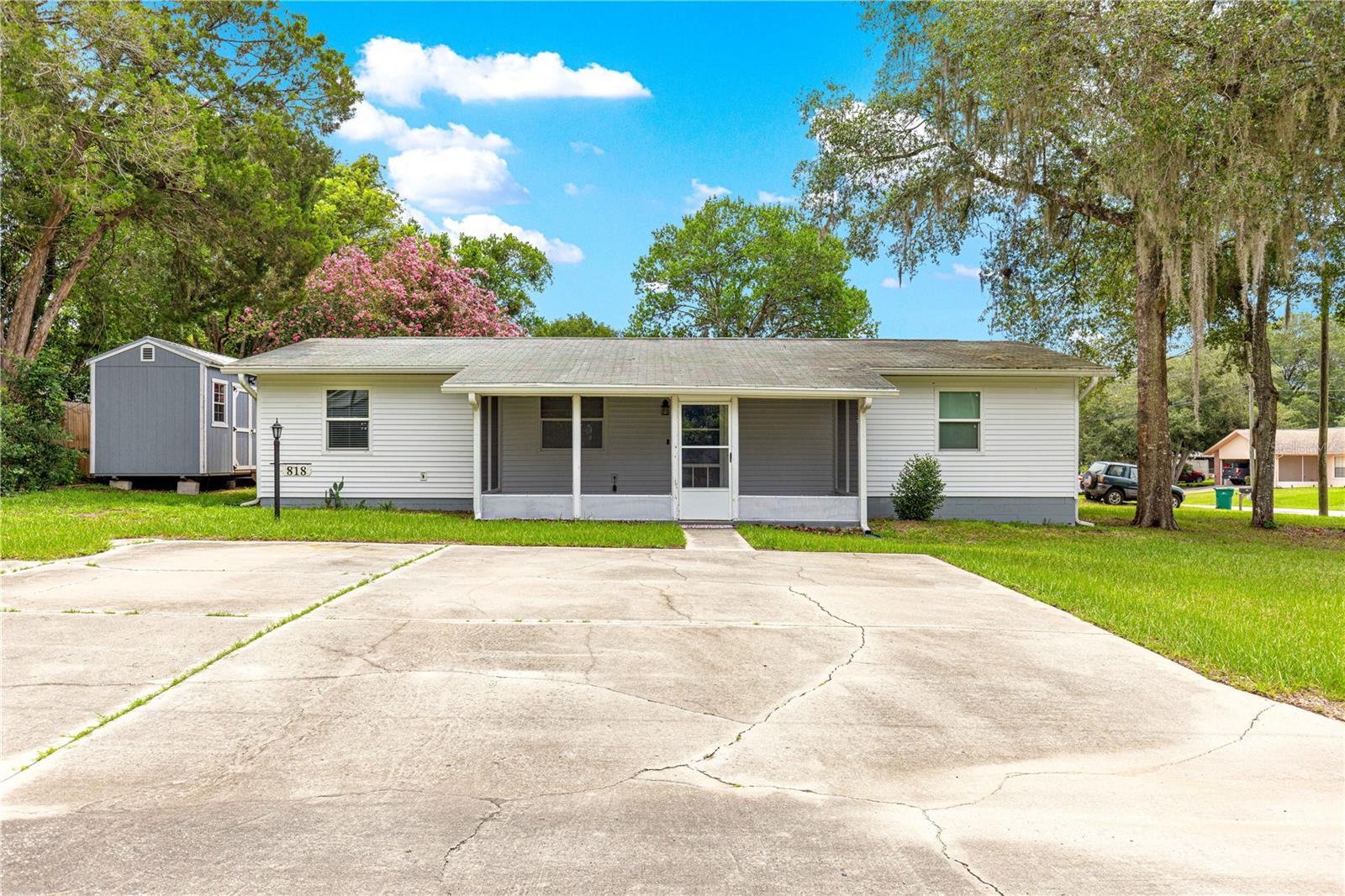 Welcome to this lovely and charming home featuring 4 bedrooms and 2 baths on a CORNER LOT! Located in a sought after neighborhood this home has so many features to love! From the large screened-in front porch, to the updates within the home, to the private backyard, this is a perfect location to create new memories. A few of the updates include, roof in 2014, AC 2024 with lifetime warranty, new vinyl siding 2024, updated kitchen with stone counters in 2024, stainless steel fridge in 2024, rest of the appliances in 2016 , windows in 2015, water heater 2016, water softener in 2016 and a new septic drain field. A custom pantry and interior utility room add to the conveniences included with this home. A private backyard with a patio tucked behind a 130 sq. ft. storage shed makes for your own retreat. Nothing to do but to move in and start enjoying this home. Schedule your private tour today!